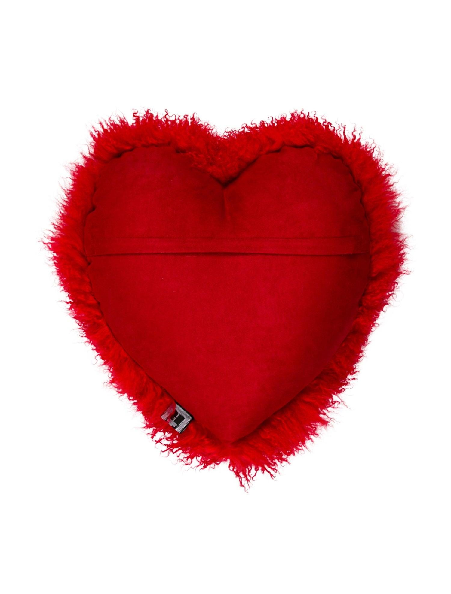 Red Mongolian lamb heart pillow by Helen Yarmak with concealed closure and brand label on the back.
It's the season of love, so bring that love into your decor with this irresistibly plush large Mongolian lamb heart pillow.This timeless piece will