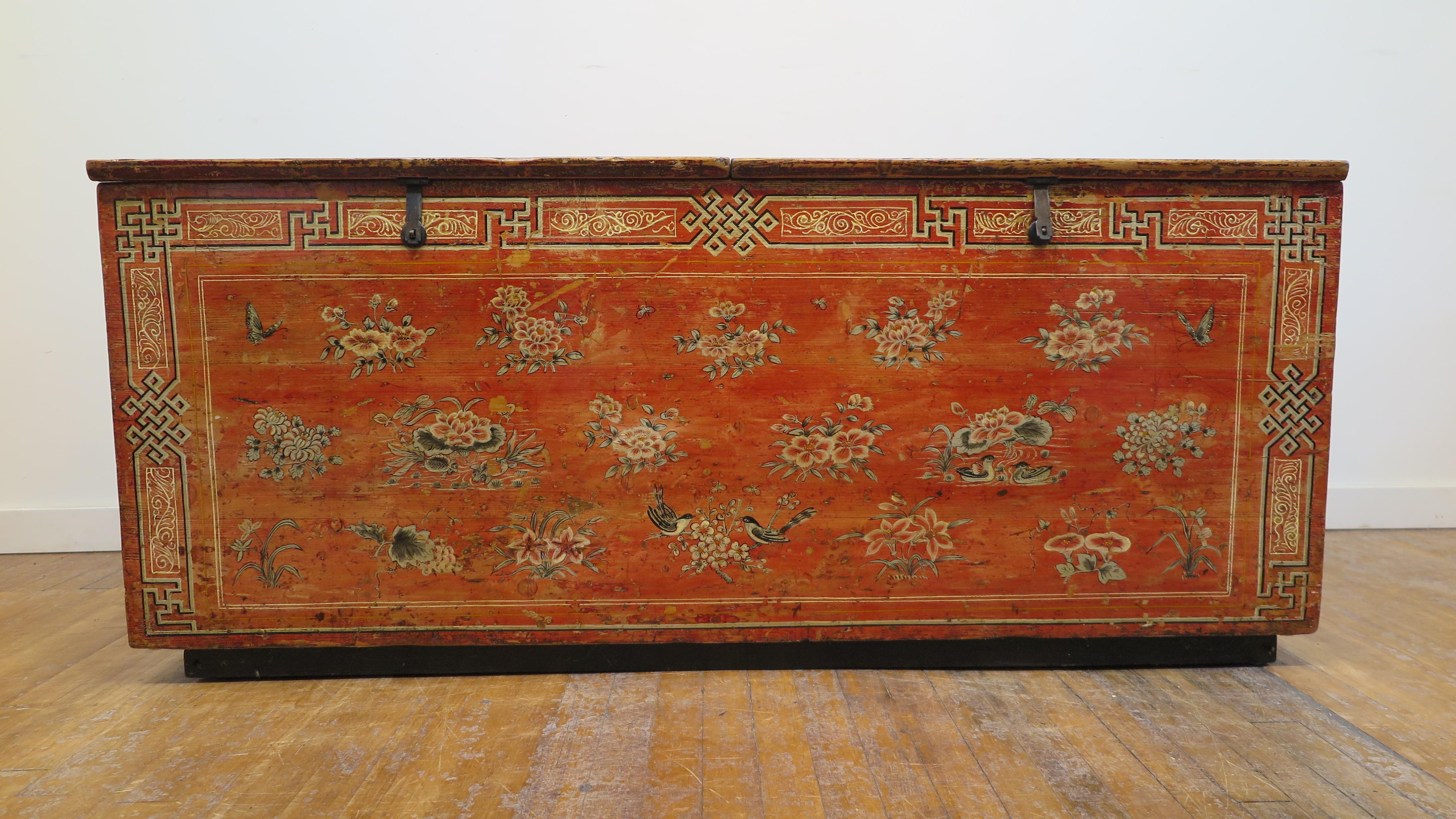 A beautifully painted Mongolian wooden chest of the 19th century. This is a wonderful example exhibiting the art work in the region. Large hand made hand decorated Mongolian painted storage chest. A well preserved patina showcasing its history alive