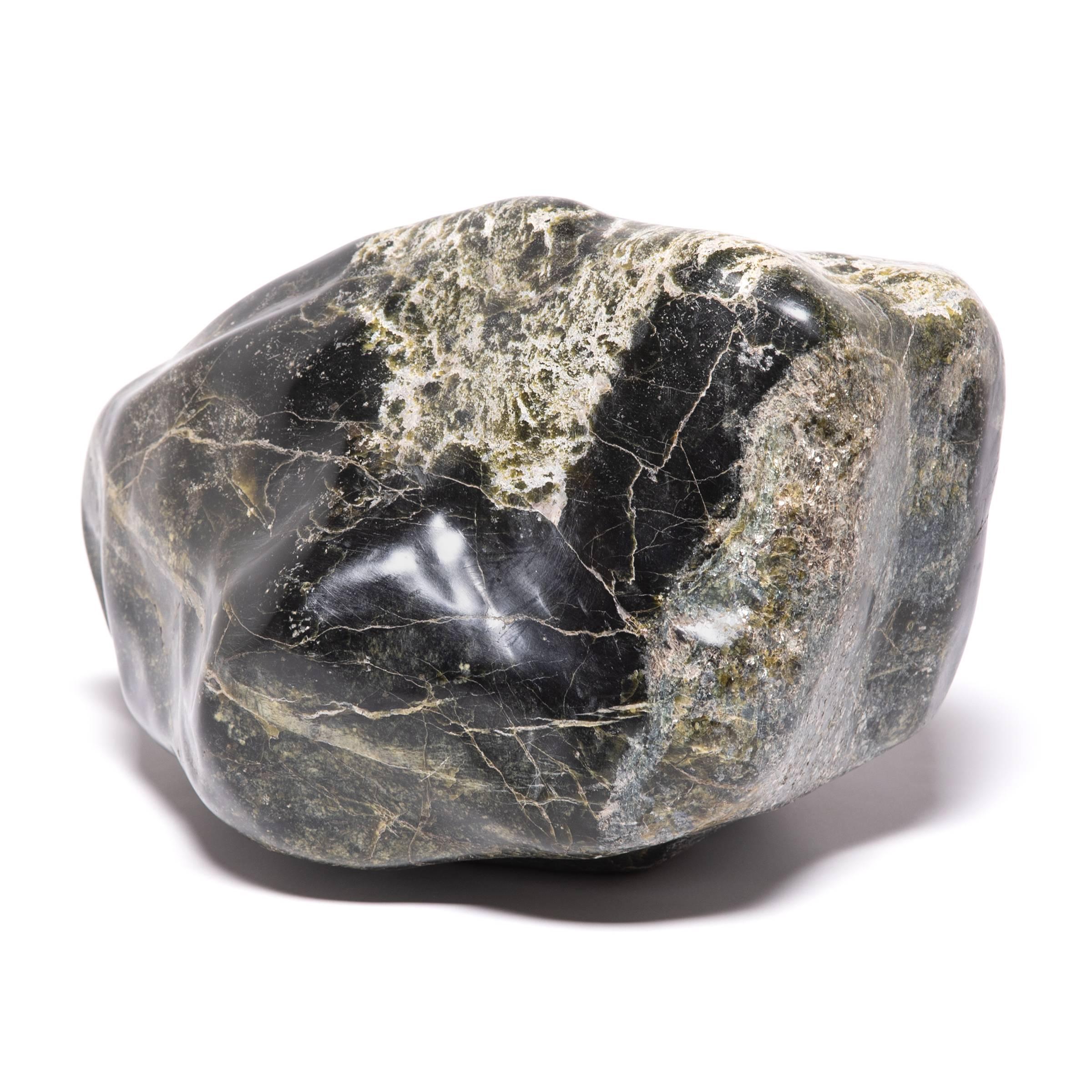 A well-chosen stone is a focal point of both a traditional Chinese garden and a scholar's studio, evoking the grandeur of nature and inspiring creative thought. Meditation stones offer the mind a place to focus - not unlike modern abstract art, each