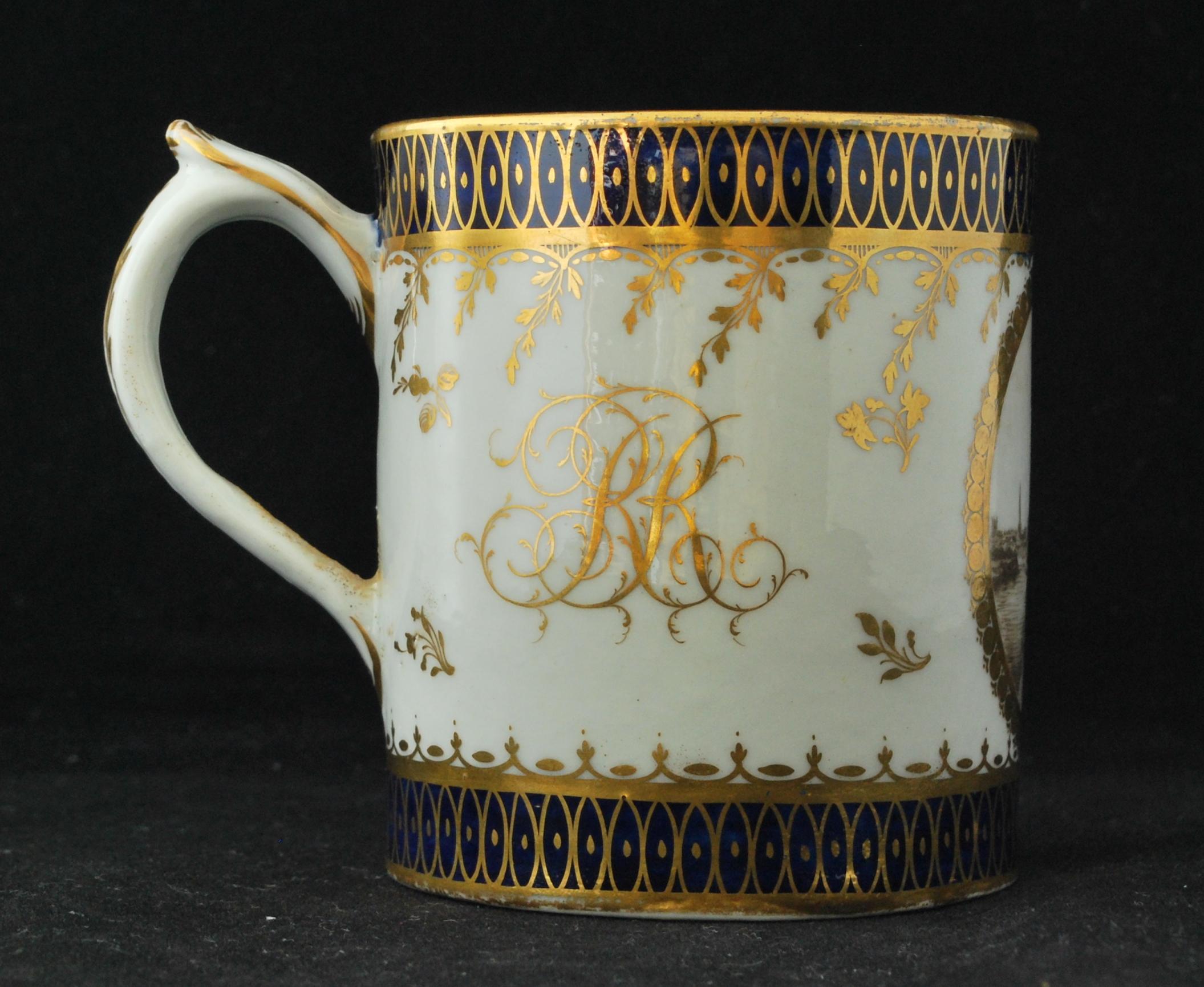 An attractive coffee can, painted with a very fine landscape, and marked with the initials RR.