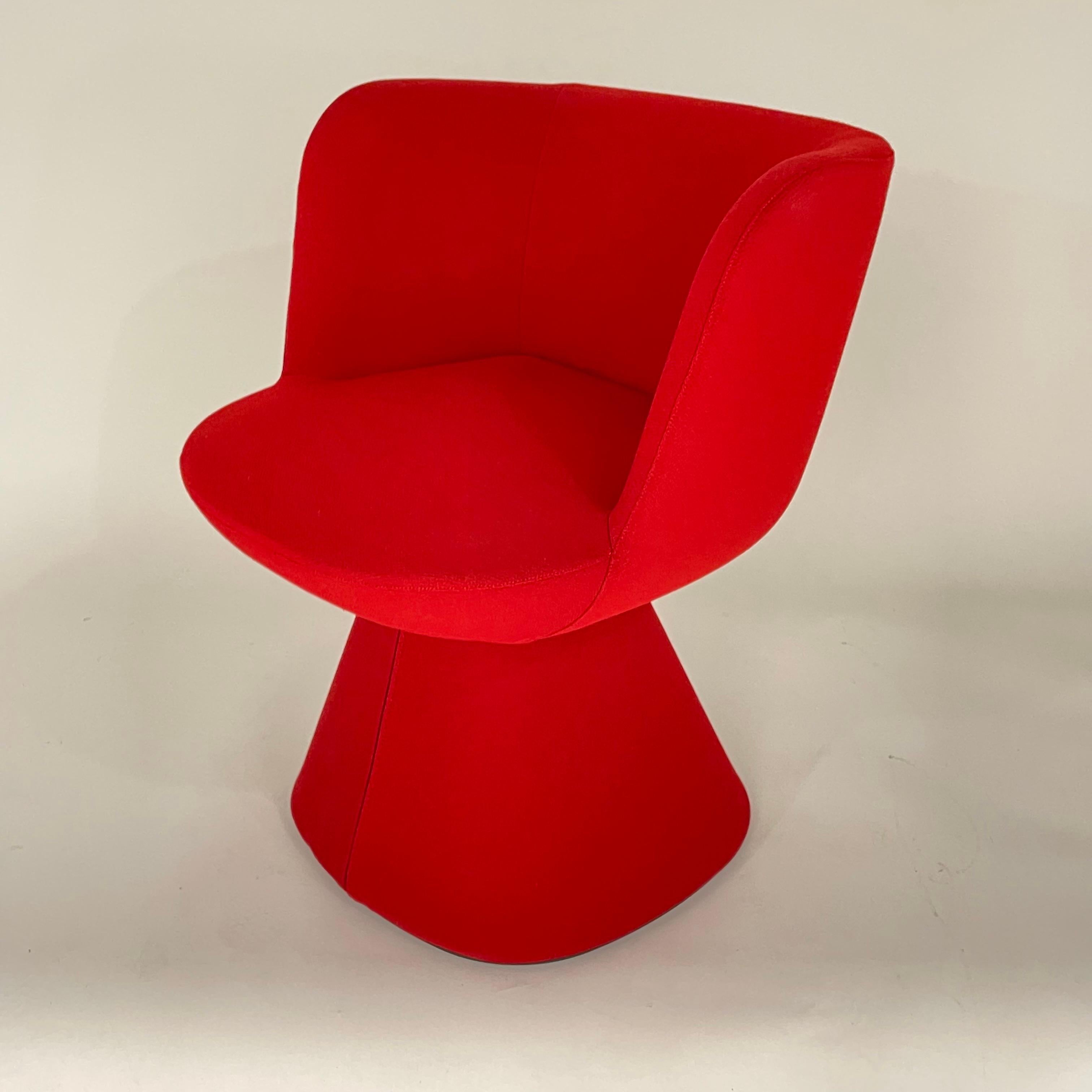 Modern Flair O' rotating swivel dining chair rendered in a luxurious red fabric with an auto return swivel mechanism perfect for dining room chairs, game chairs, or side chairs. Designed by Monica Armani for B & B Italia, Italy 2022