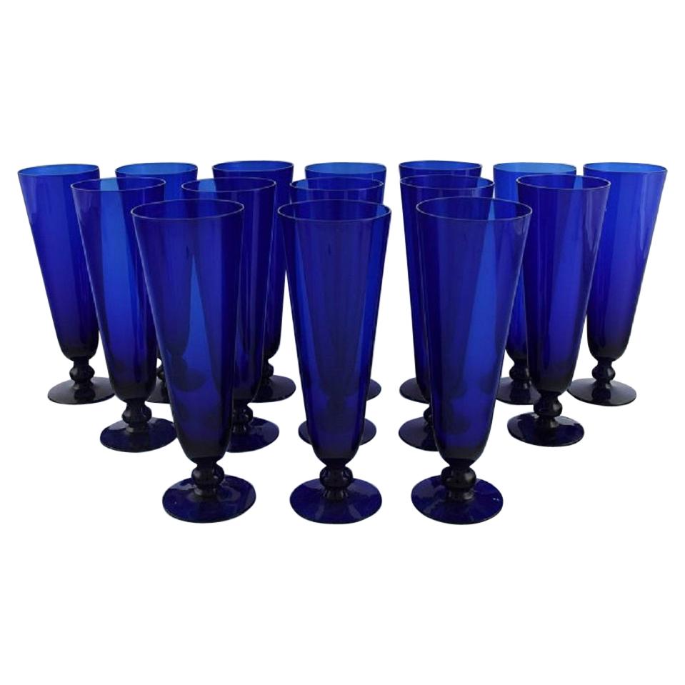 Monica Bratt for Reijmyre, 15 Champagne Flutes in Blue Mouth Blown Art Glass