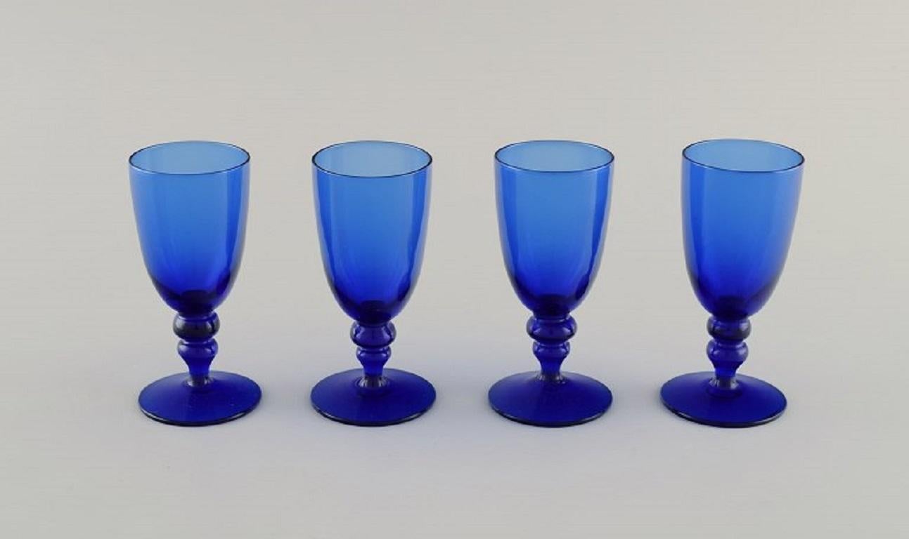 Monica Bratt for Reijmyre. Four shot glasses in blue mouth-blown art glass. 
Swedish design, mid 20th century.
Measures: 9 x 4 cm.
In excellent condition.