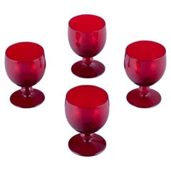 Monica Bratt for Reijmyre. Set of four small wine glasses in red art glass