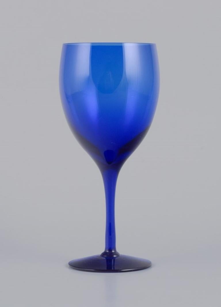 Swedish Monica Bratt for Reijmyre. Set of six red wine glasses in blue art glass. For Sale