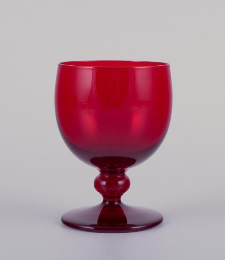 Monica Bratt for Reijmyre, Sweden. 
A set of six small wine glasses in red mouth-blown art glass.
1960s/1970s.
Perfect condition.
Dimensions: H 9.4 cm, D 6.4 cm.

Founded in 1810 in the southern region of Sweden, Reijmyre Glassworks gained