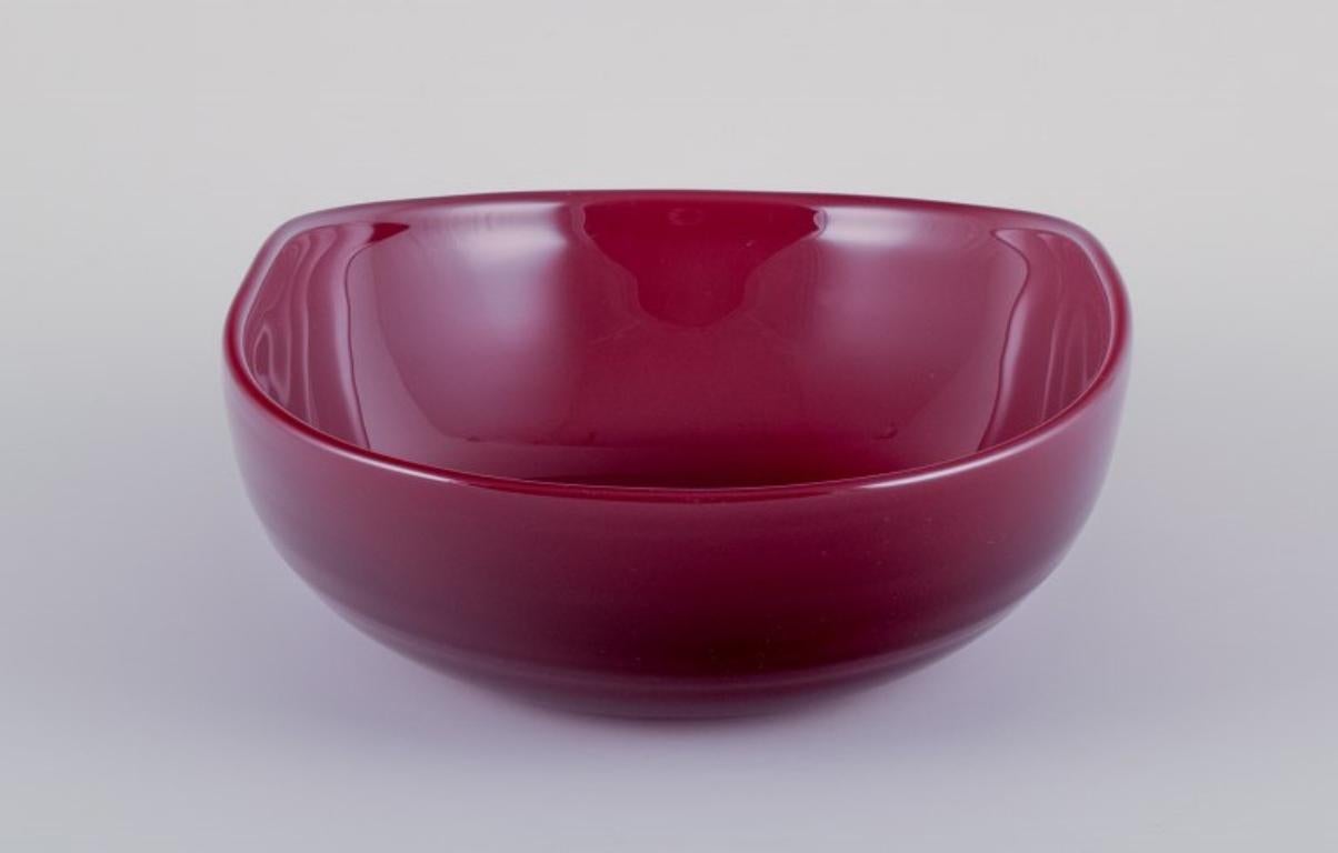 Scandinavian Modern Monica Bratt for Reijmyre, Sweden. Large oval bowl in wine red art glass For Sale