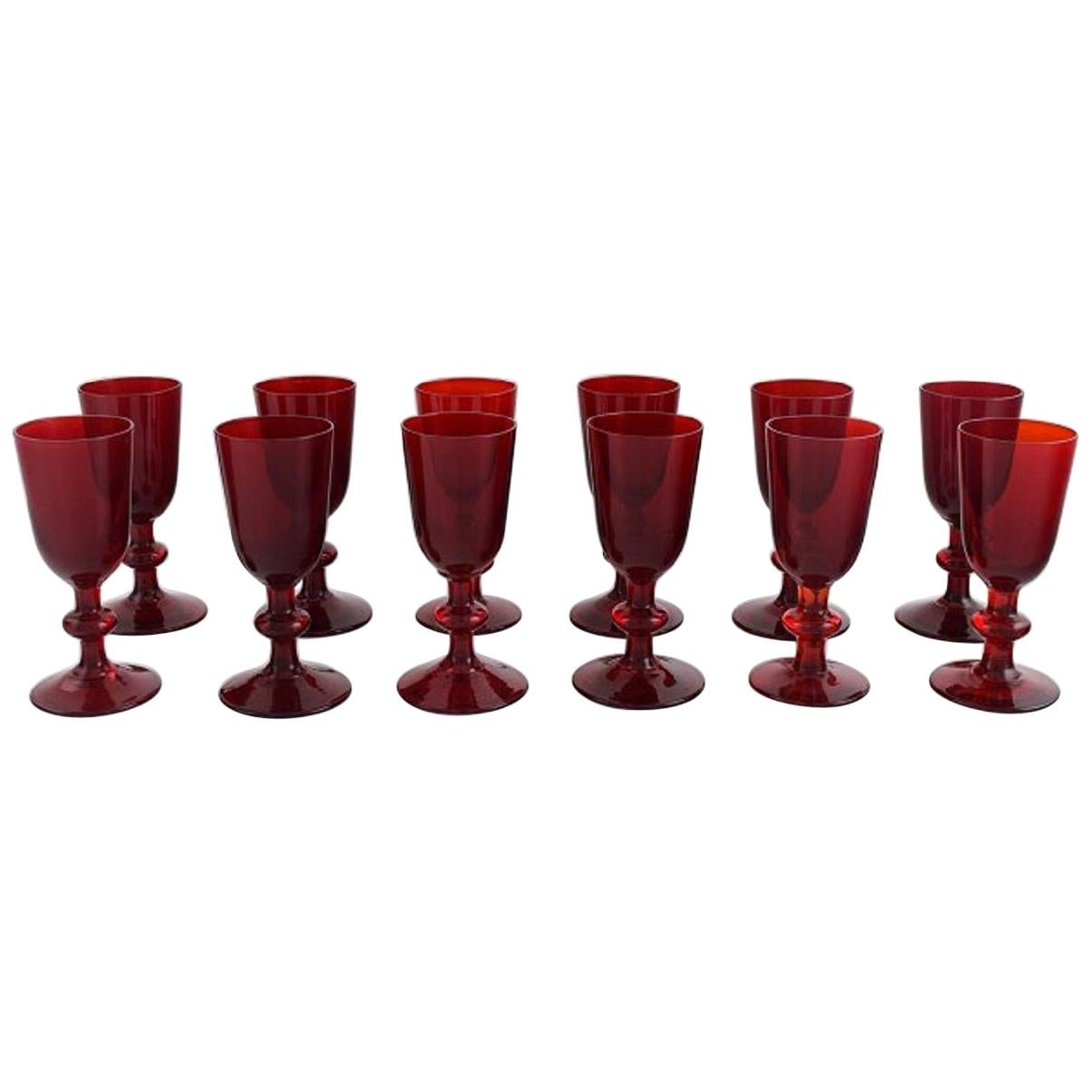 Monica Bratt for Reijmyre, Twelve Liqueur Glasses in Red Mouth Blown Art Glass For Sale