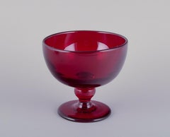 Monica Bratt for Reijmyre. Two bowls in wine-red mouth-blown art glass