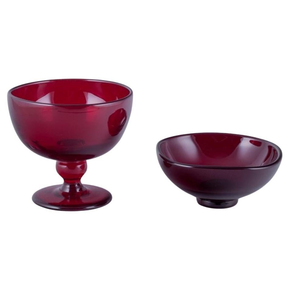Monica Bratt for Reijmyre. Two bowls in wine-red mouth-blown art glass For Sale