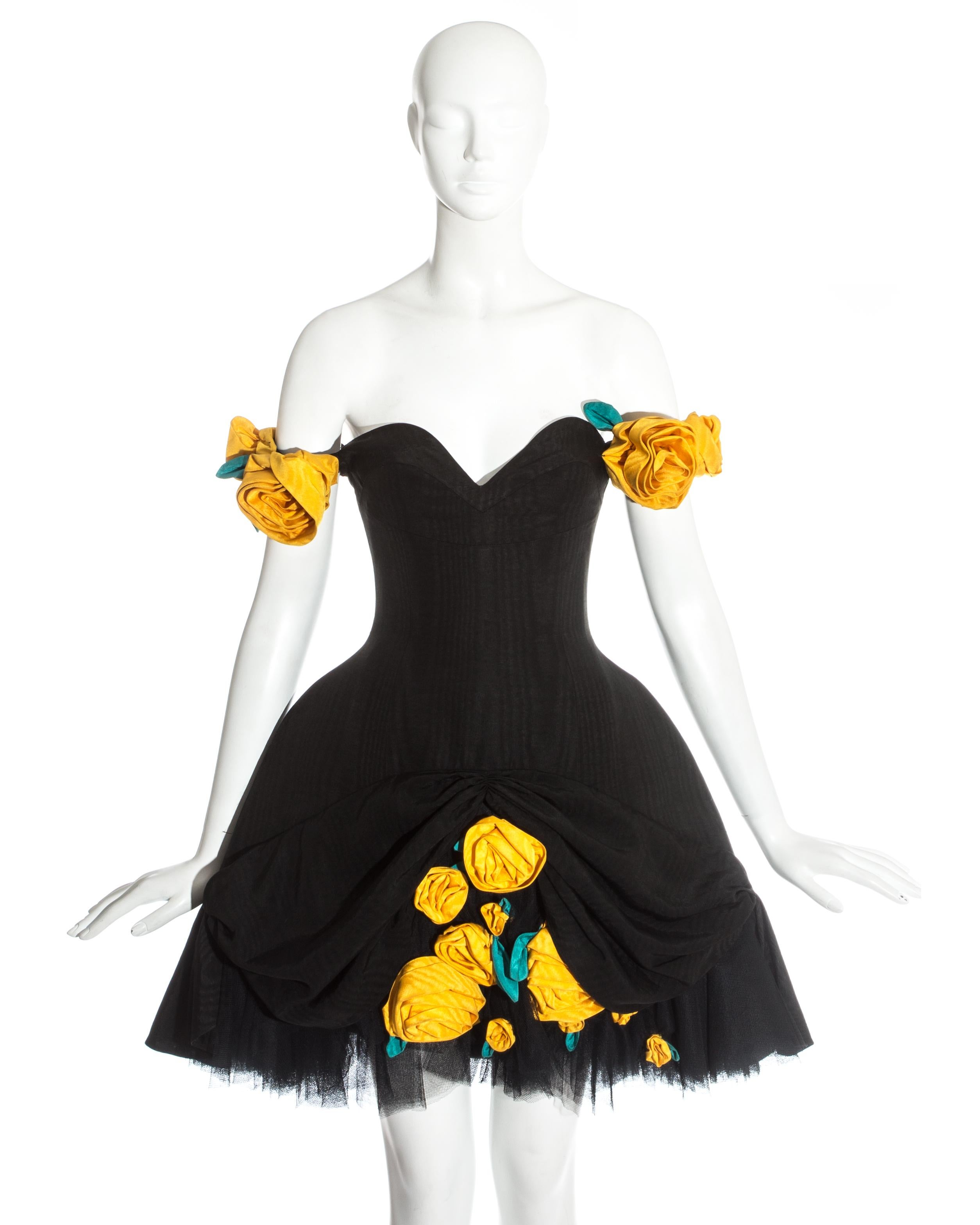 Monica Chong black moire silk and tulle cocktail dress with yellow floral appliqués and hooped full skirt. 

Fall-Winter 1987

