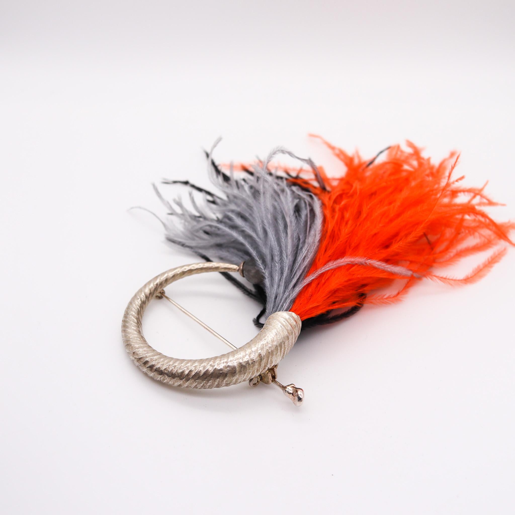 Convertible pom pom brooch designed by Monica Coscioni. 

An outstanding convertible brooch, created in the city of Orvieto Italy at the jewelry atelier of the designer Monica Coscioni. This piece has been crafted with Etruscan revival patterns in