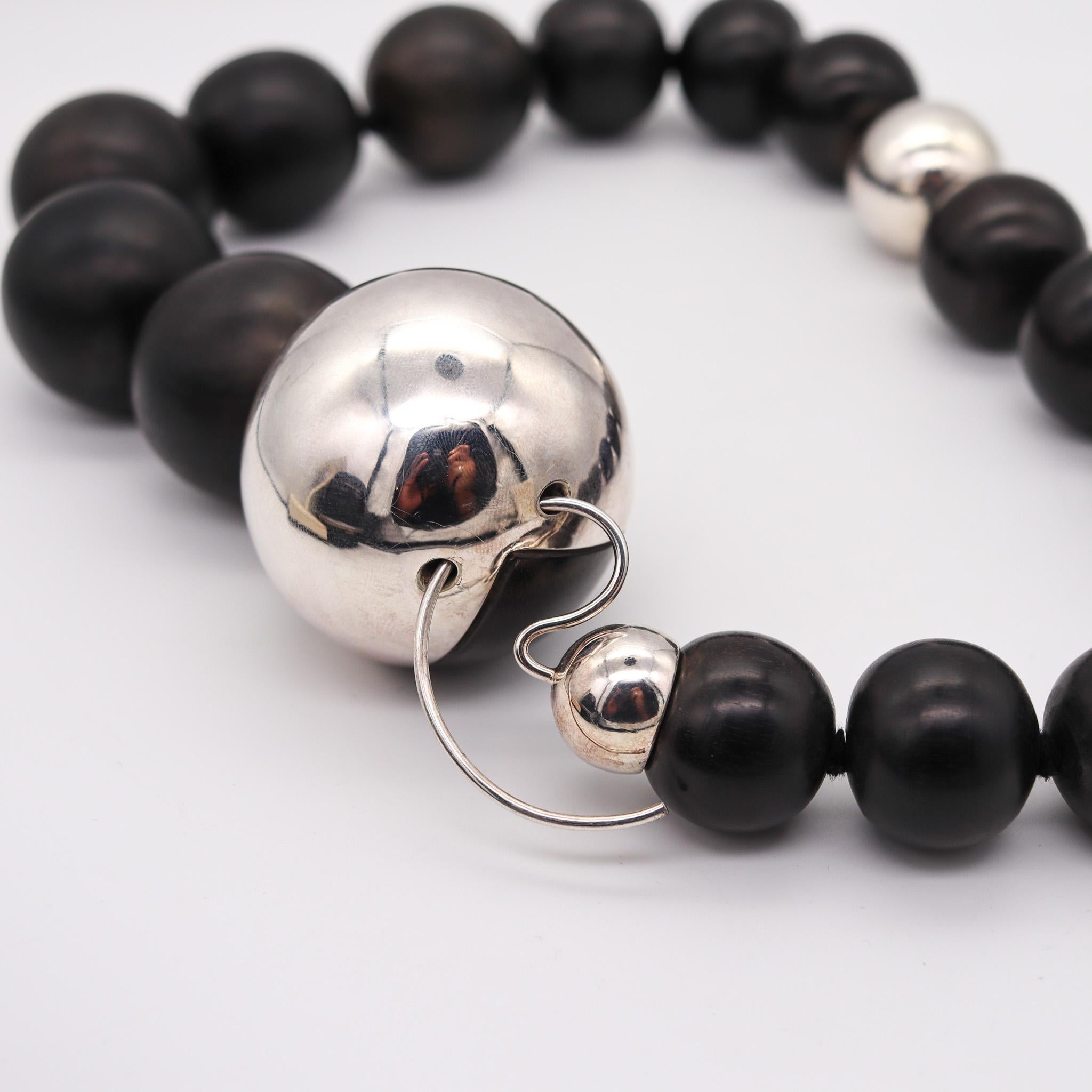 Ebony wood necklace designed by Monica Coscioni. 

Gorgeous modernist necklace, created in the city of Orvieto Italy at the jewelry atelier of the designer Monica Coscioni. This beautiful necklace has been crafted in solid .925/.999 sterling silver,