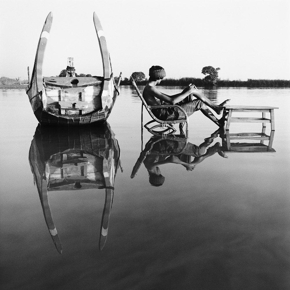 Delayed Departure by Monica Denevan, Silver Gelatin Print, 2011

Monica Denevan studied photography at San Francisco State University.  She has travelled extensively in Burma and China for many years.  Denevan’s photographs have been exhibited