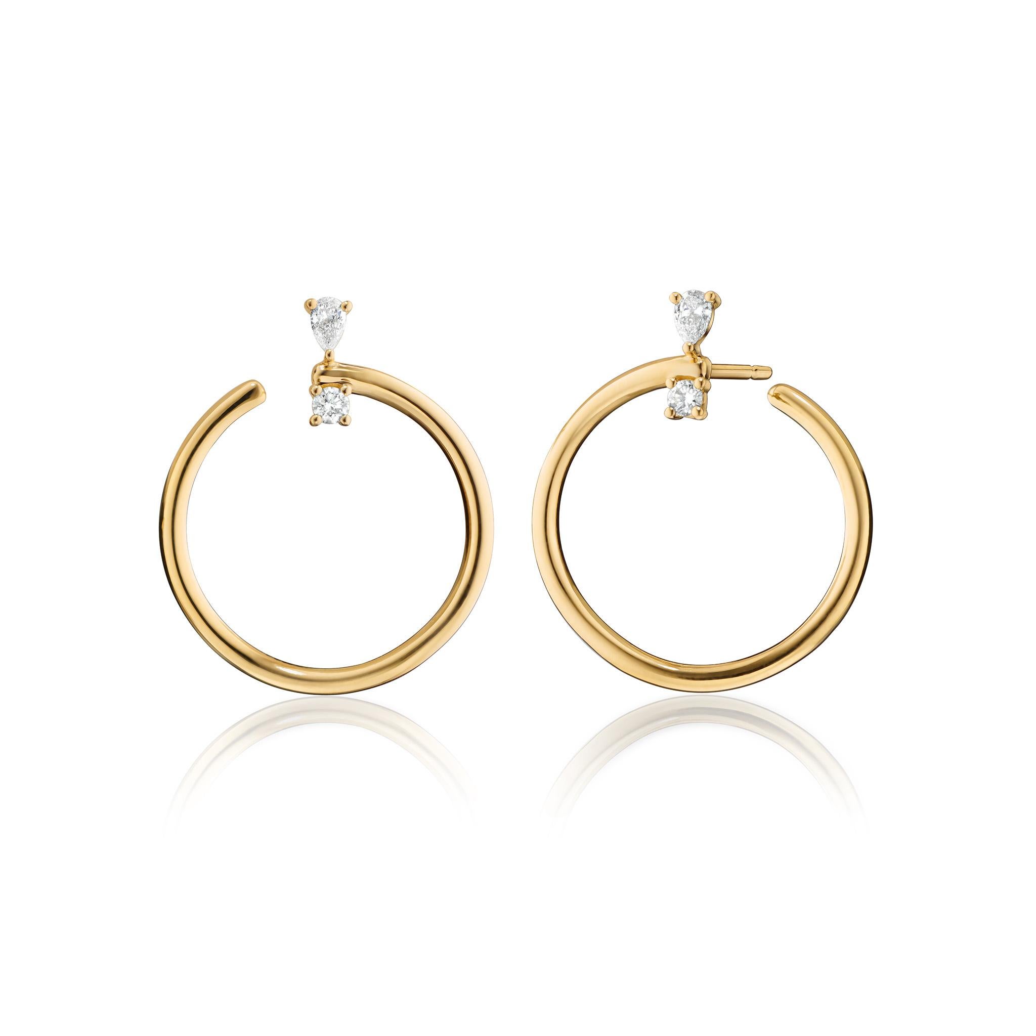 These Monica Rich Kosann galaxy inspired wrap hoop earrings begin on your ear with beautifully cut round and pear shaped diamonds. The 15/16