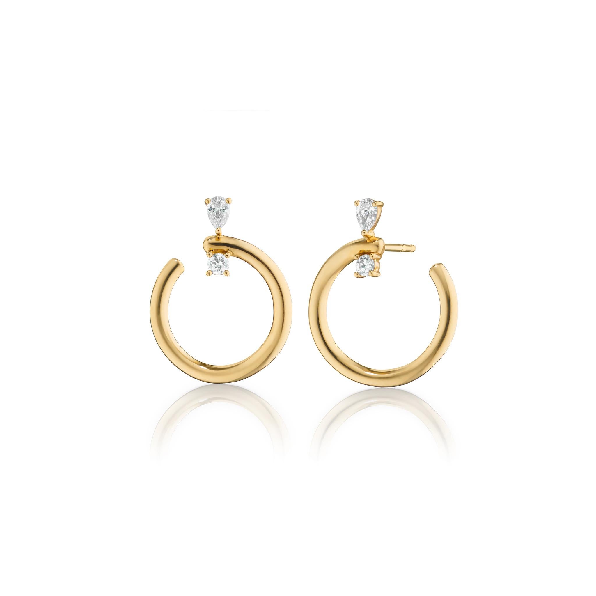 These Monica Rich Kosann galaxy inspired wrap hoop earrings begin on your ear with beautifully cut round and pear shaped diamonds. 
The 11/16