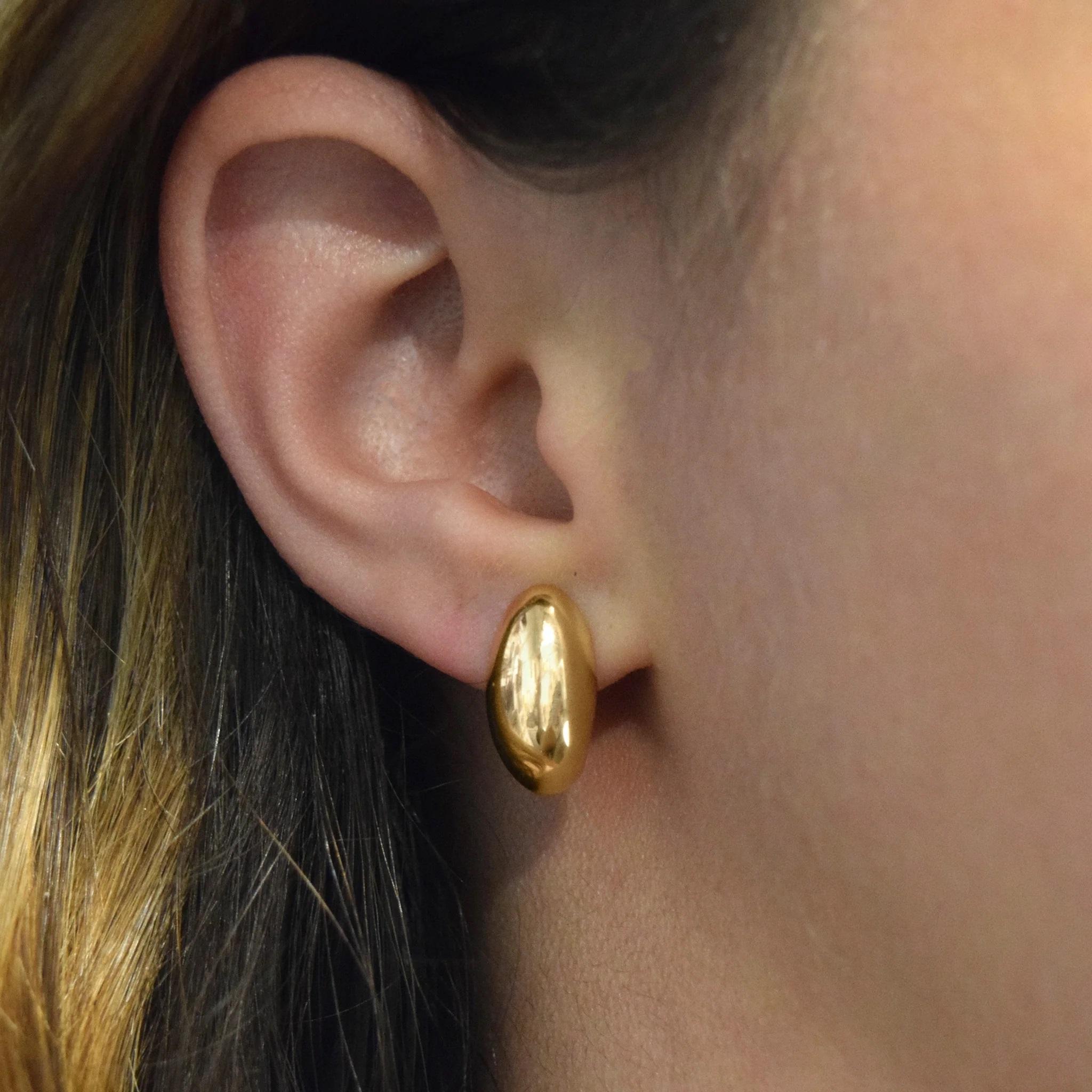 Why perseverance? Because fish only swim forward. After all, what's the point in looking back. The Iconic Monica Rich Kosann Perseverance Fish Design inspired the Sculptural Silhouette of these 18k Gold huggie earrings. They are a contemporary,