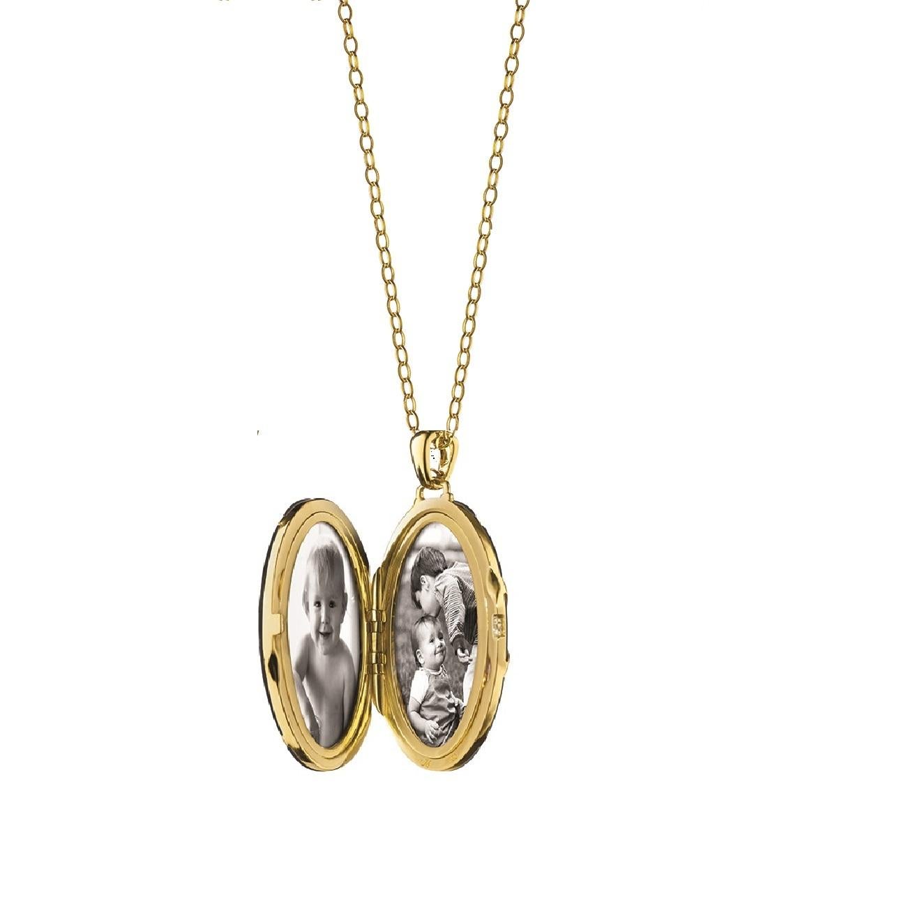 This elegant Monica Rich Kosann 18K Yellow Gold Diamond Stripe Oval Locket with Black Ceramic features a diamond stripe on the front of the locket and is presented on a gold 32 open link chain. 

MRK2100- in Ceramic and 18K Gold- Represents the