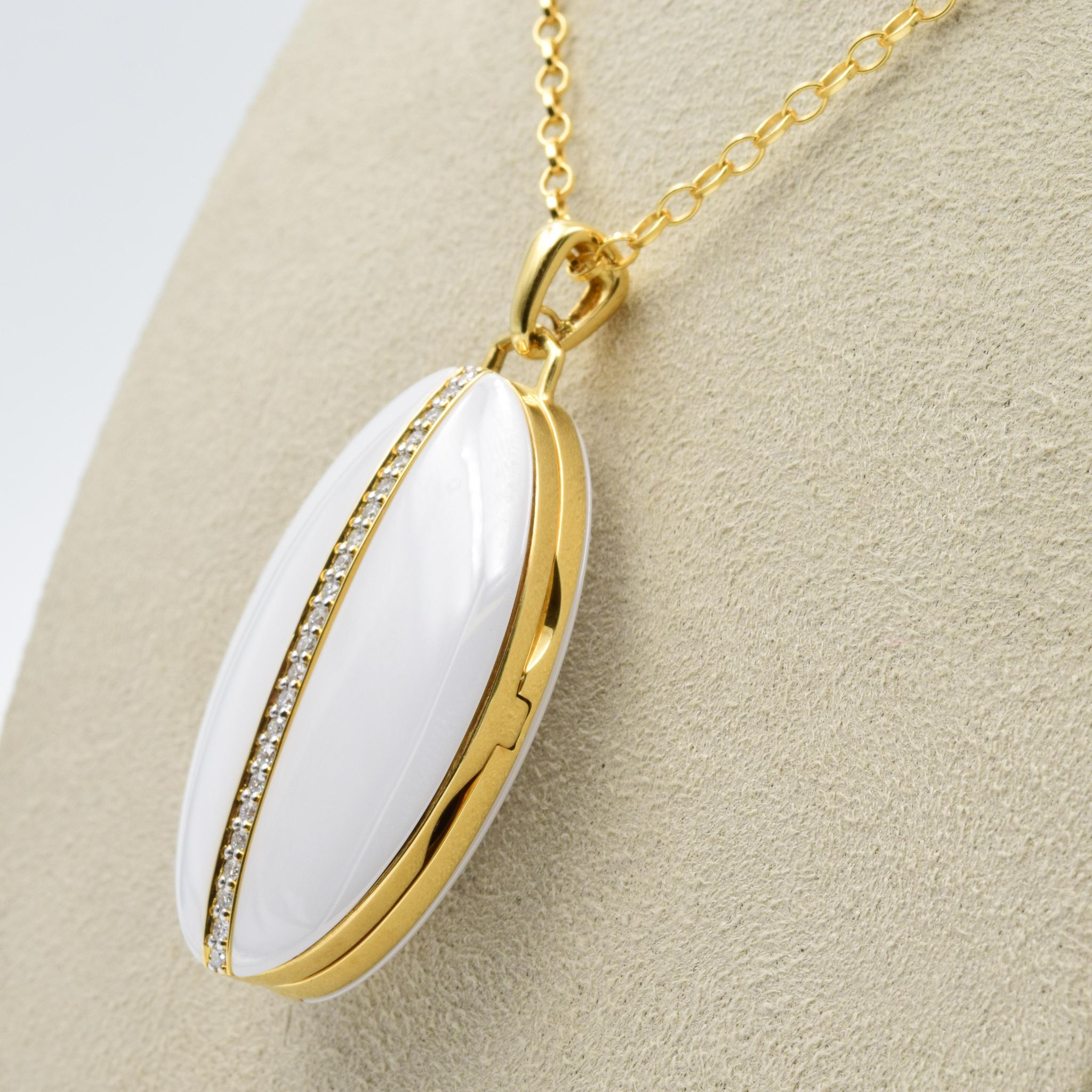 This is a brand new Monica Rich Kosann piece and we are an authorized dealer.  Please let us know if you have any further questions on this piece.  

Style Number: 46601-WHITE
18K Yellow Gold and Ceramic
32” Yellow Gold Chain
Set with Diamonds:
