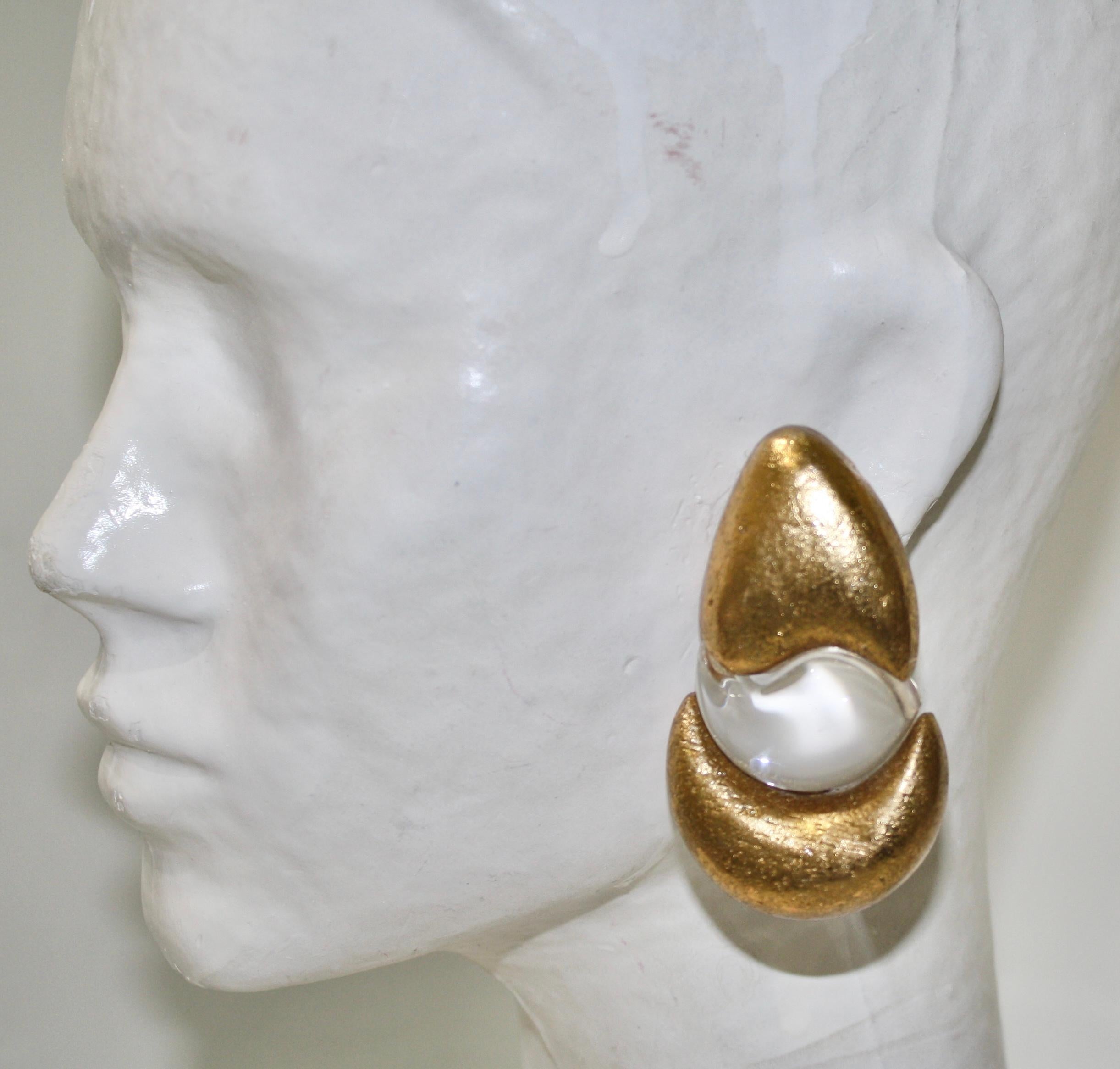 Stylish  oversized clip-on earrings by Gerda Lyngaard for Monies. Crystal clear acrylic and acacia with gold foil application. Marked 'Monies' on the clasp. 