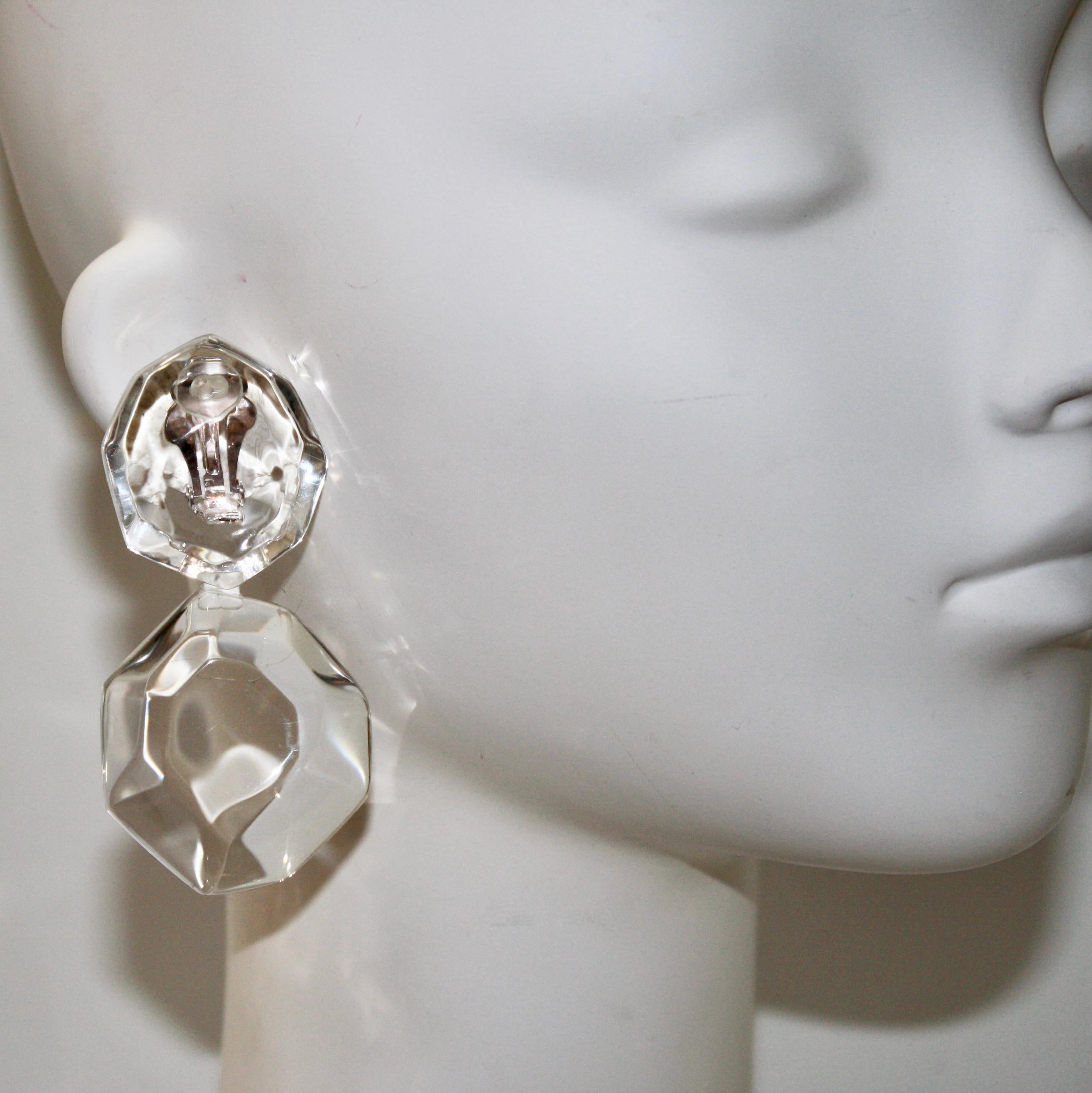 Clip earrings with oversized faceted acrylic elements. Signature on clasp.