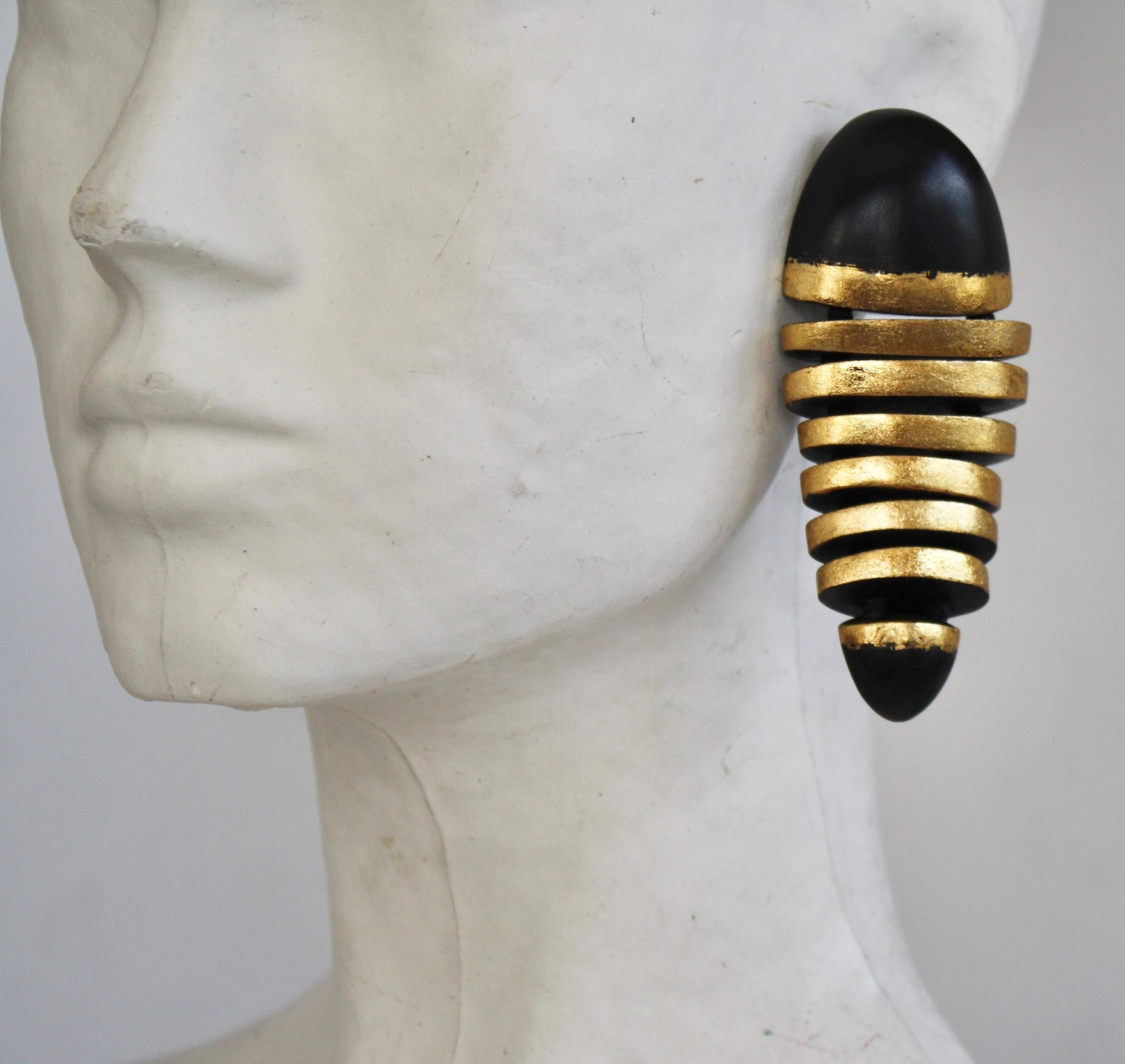 Gold leaf and wood articulated element clip earrings from Monies Denmark. 