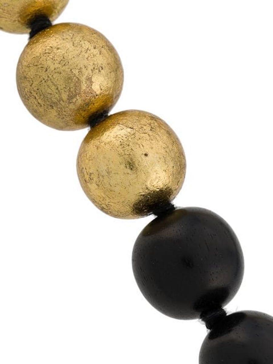 Ebony wood and gold leaf bead necklace from Monies Denmark. 