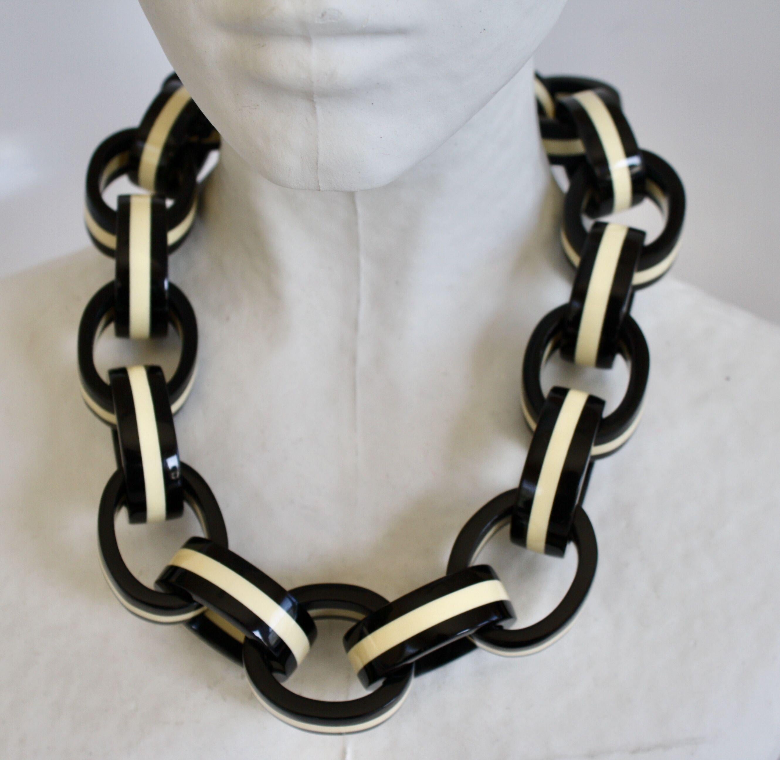 Polyester oval links necklace in black and white stripes from Monies Denmark. 

Each oval link is about 1-3/4