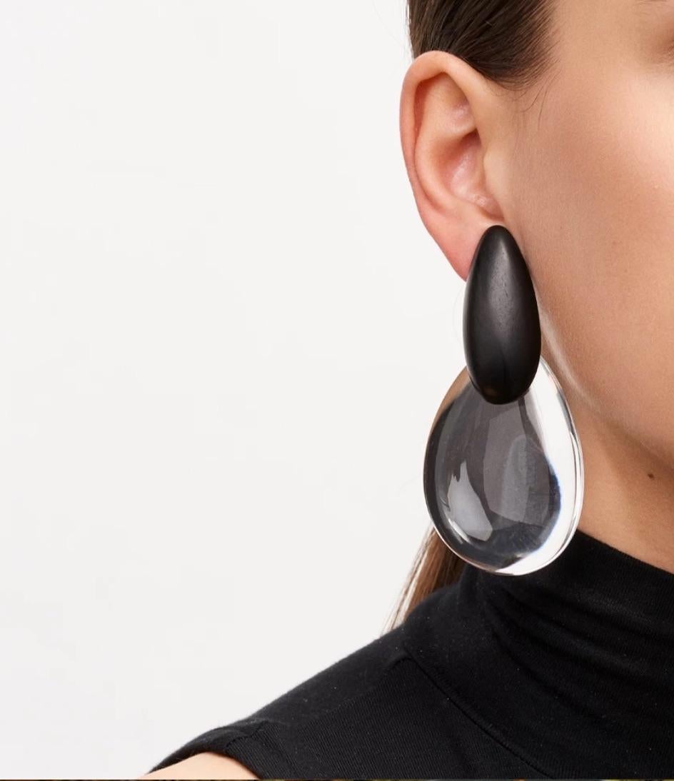Lightweight oversized ebony wood and acrylic clip earrings from Monies Denmark. 