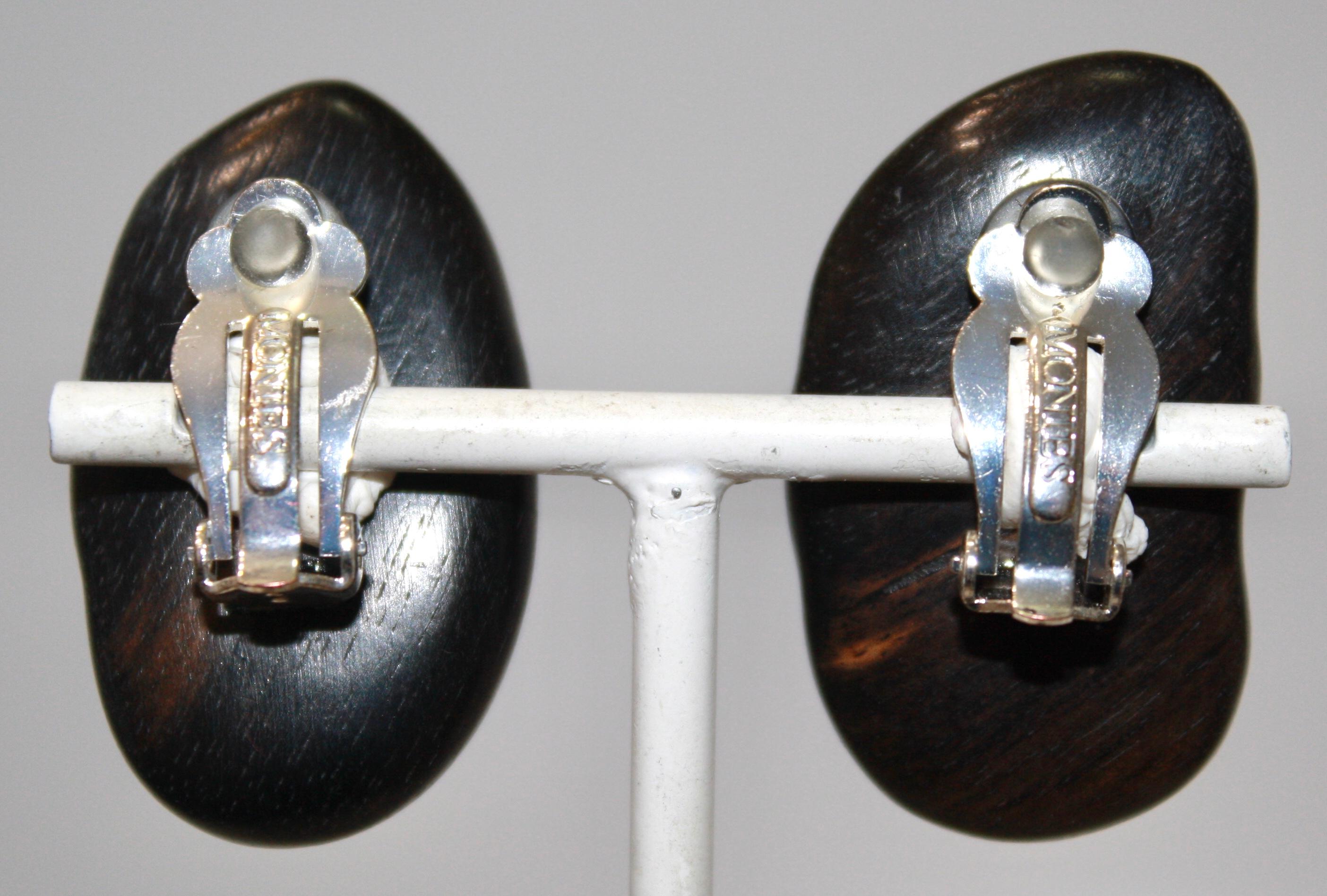 Unique oversized freshwater pearls set on ebony. Clip earrings.