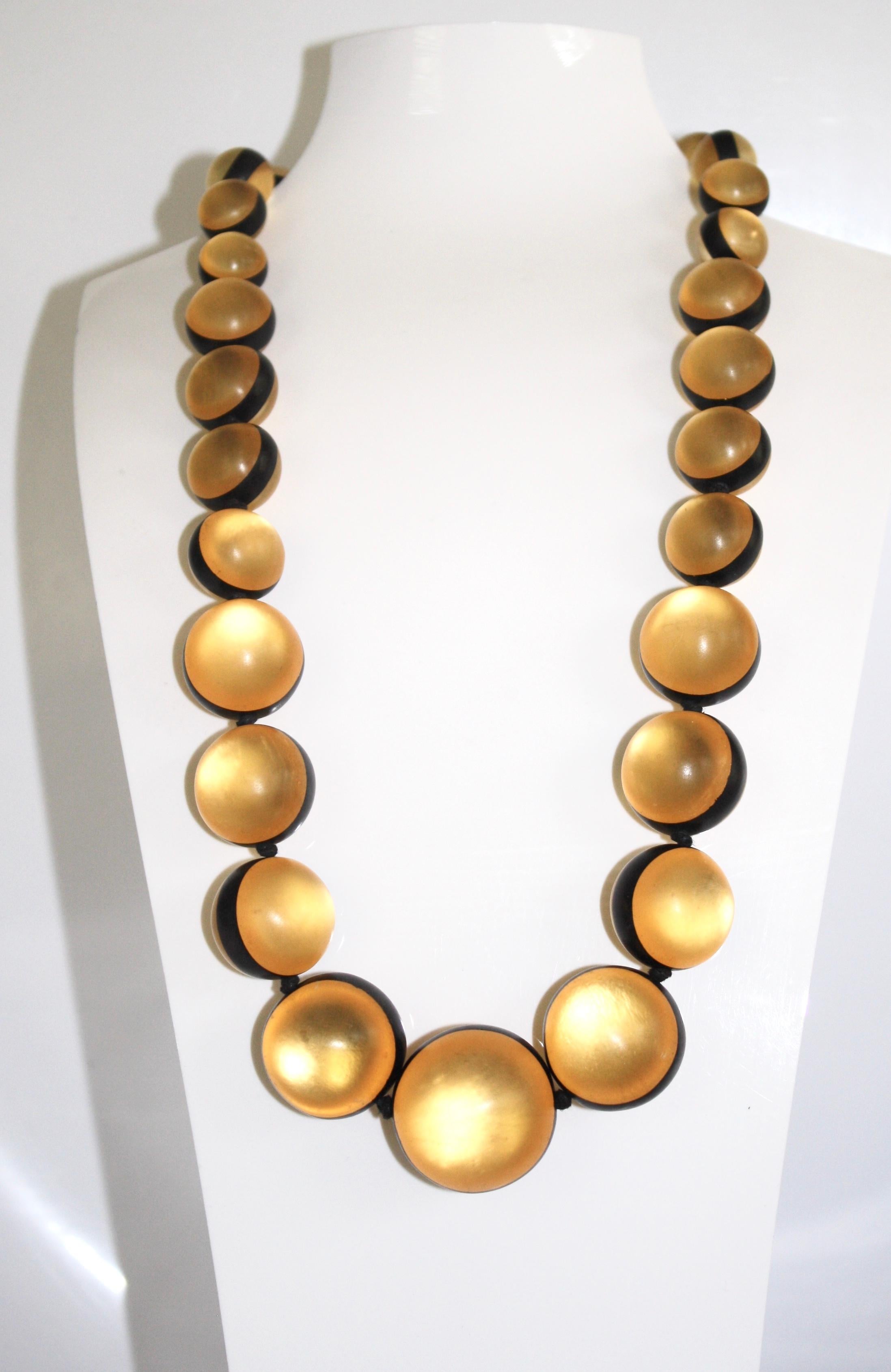 Long lightweight statement necklace made with acrylic and leather from Monies Denmark. 