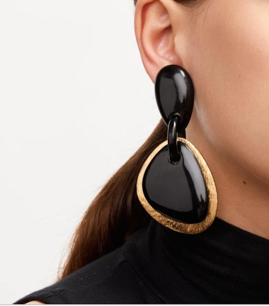 Chic and lightweight black horn and gold foil clip earrings from Monies Denmark. 