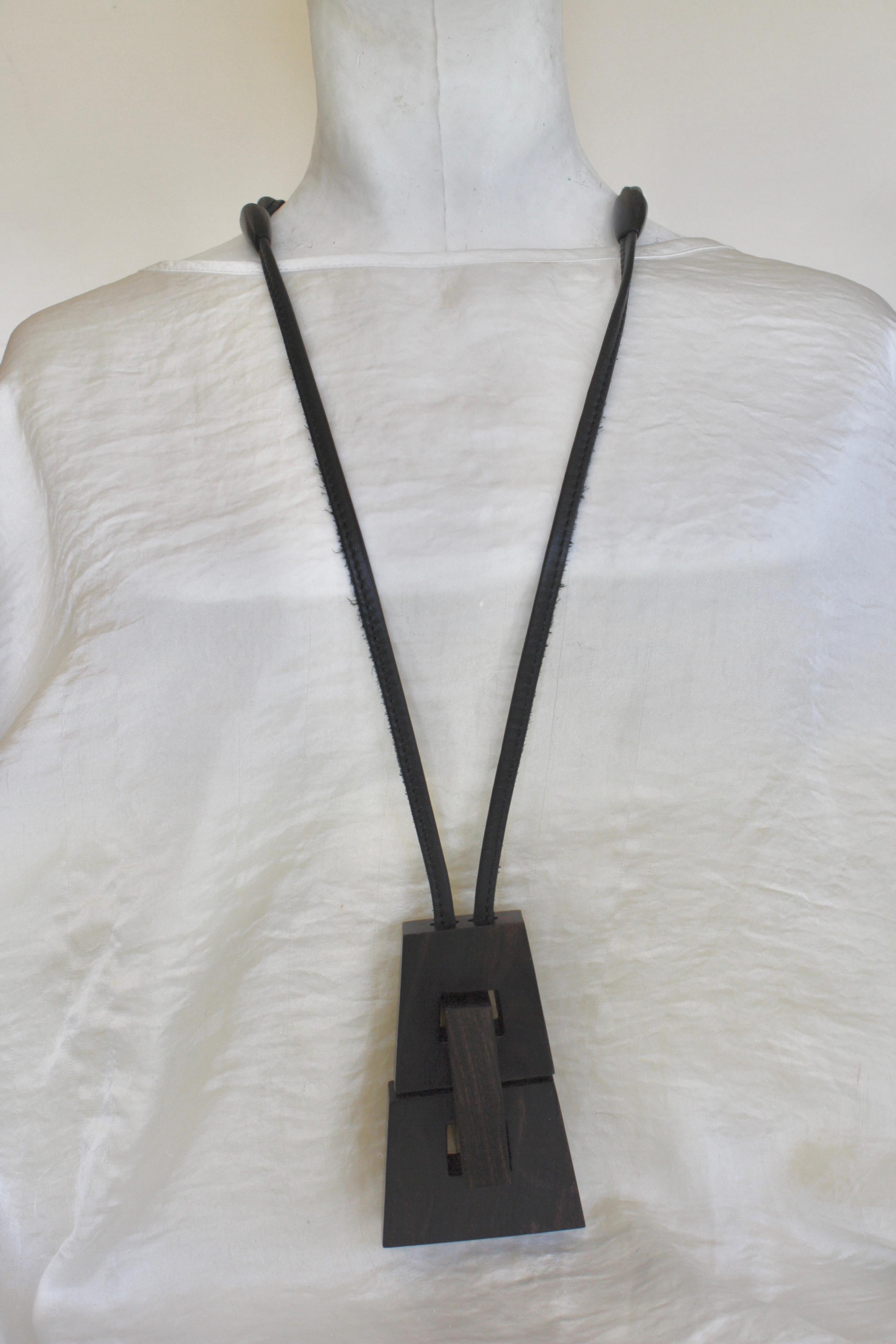 Leather and wood pendant necklace from Monies Denmark. Pendant is 2.75