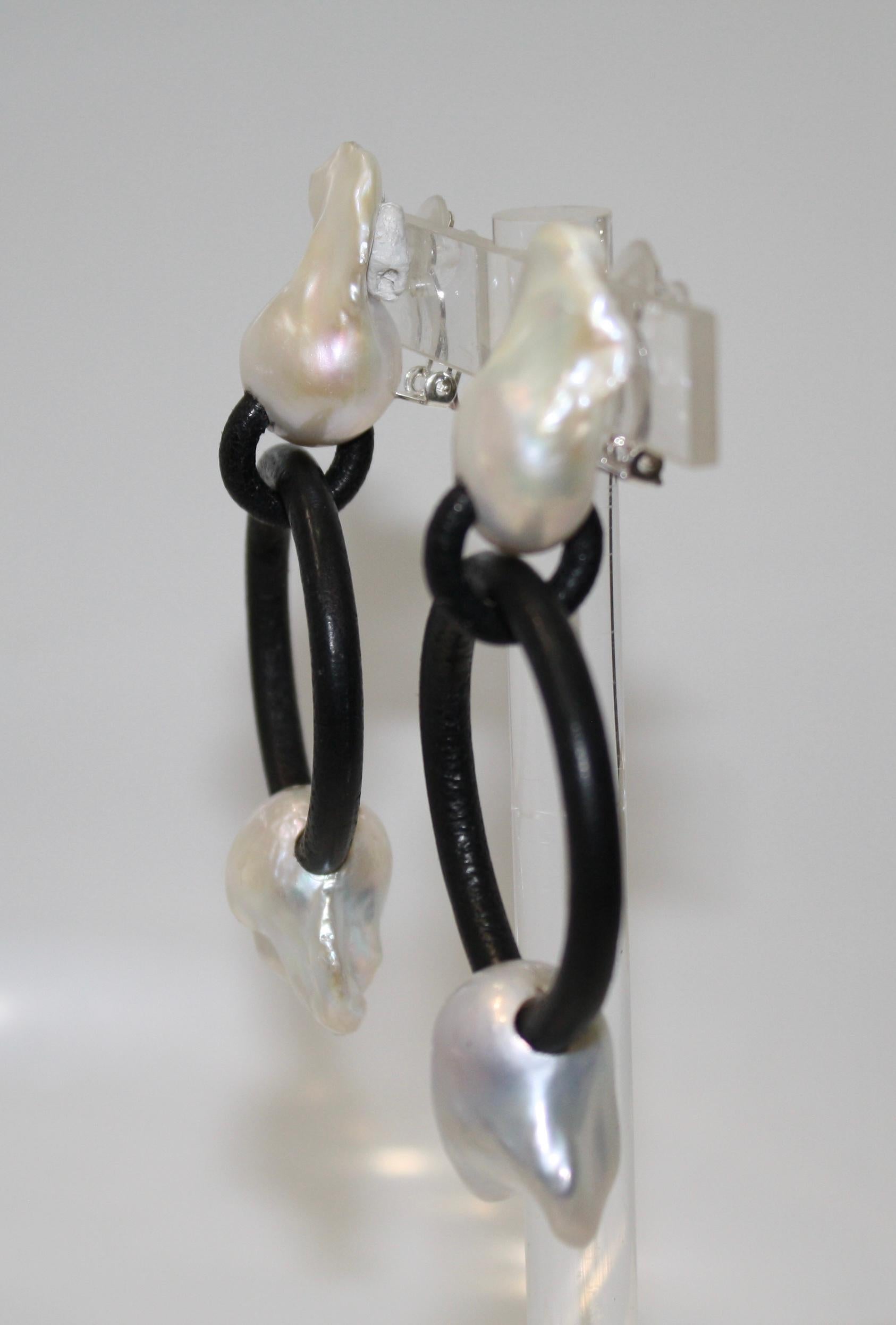Clip earrings with baroque pearl on the top and leather hoop with threaded pearl. The shape and form of the pearls vary since the are unique and no pearls are the same.
Top pearls are 1.5” long, 1” wide
MONIES IS A DANISH JEWELLERY COMPANY FOUNDED