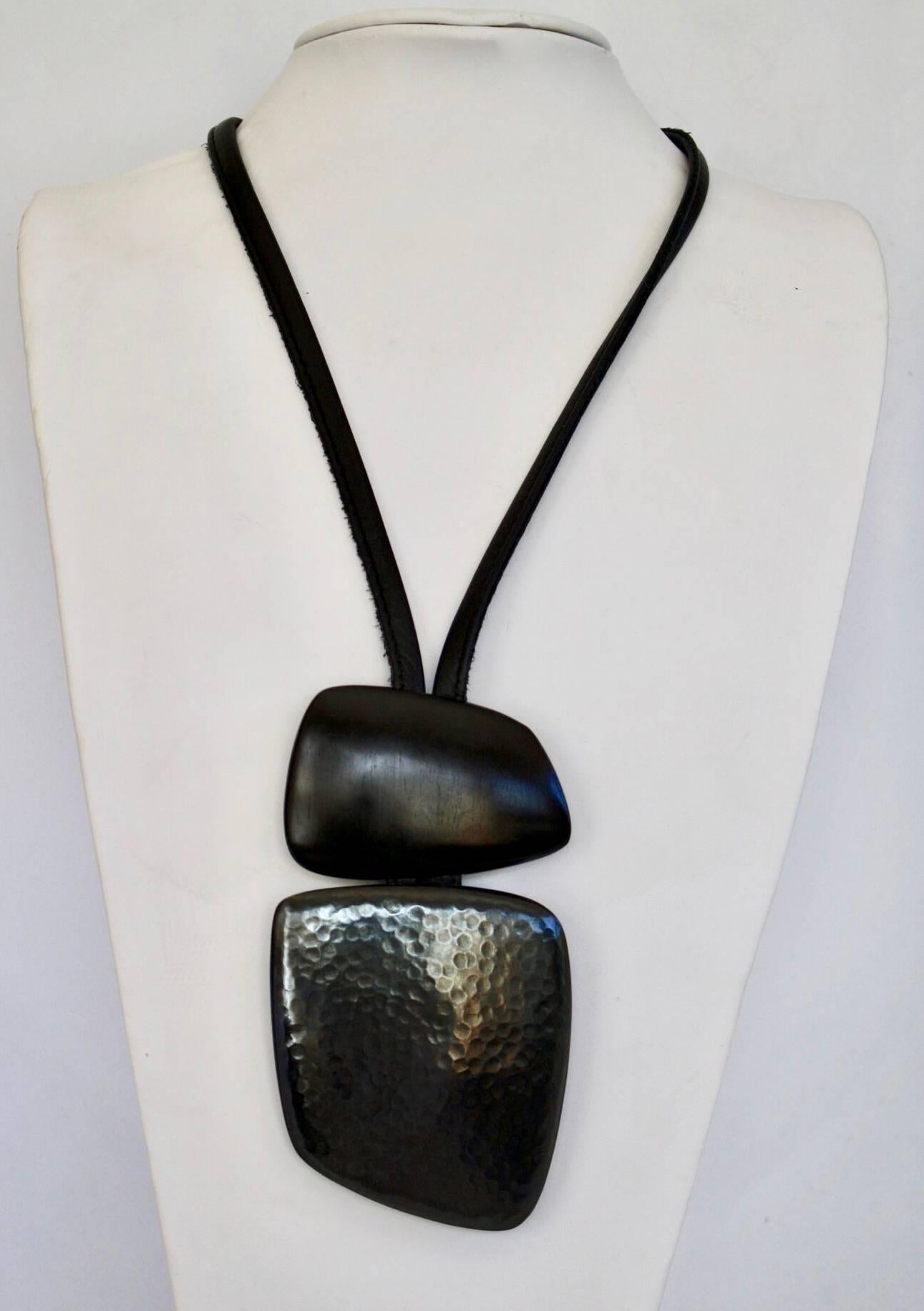 Leather, ebony wood, and oxidized copper pendant necklace from Monies Denmark. 