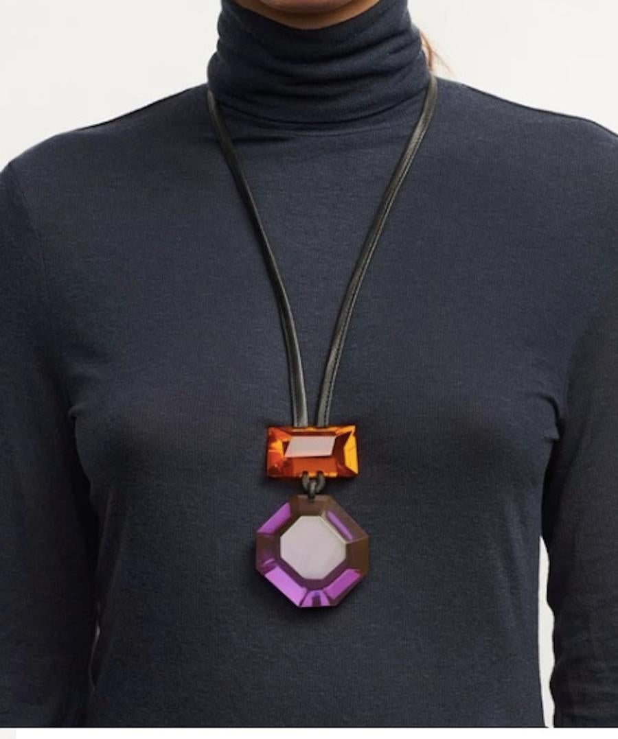 Orange and purple lightweight polyester necklace on leather cording from Monies Denmark.