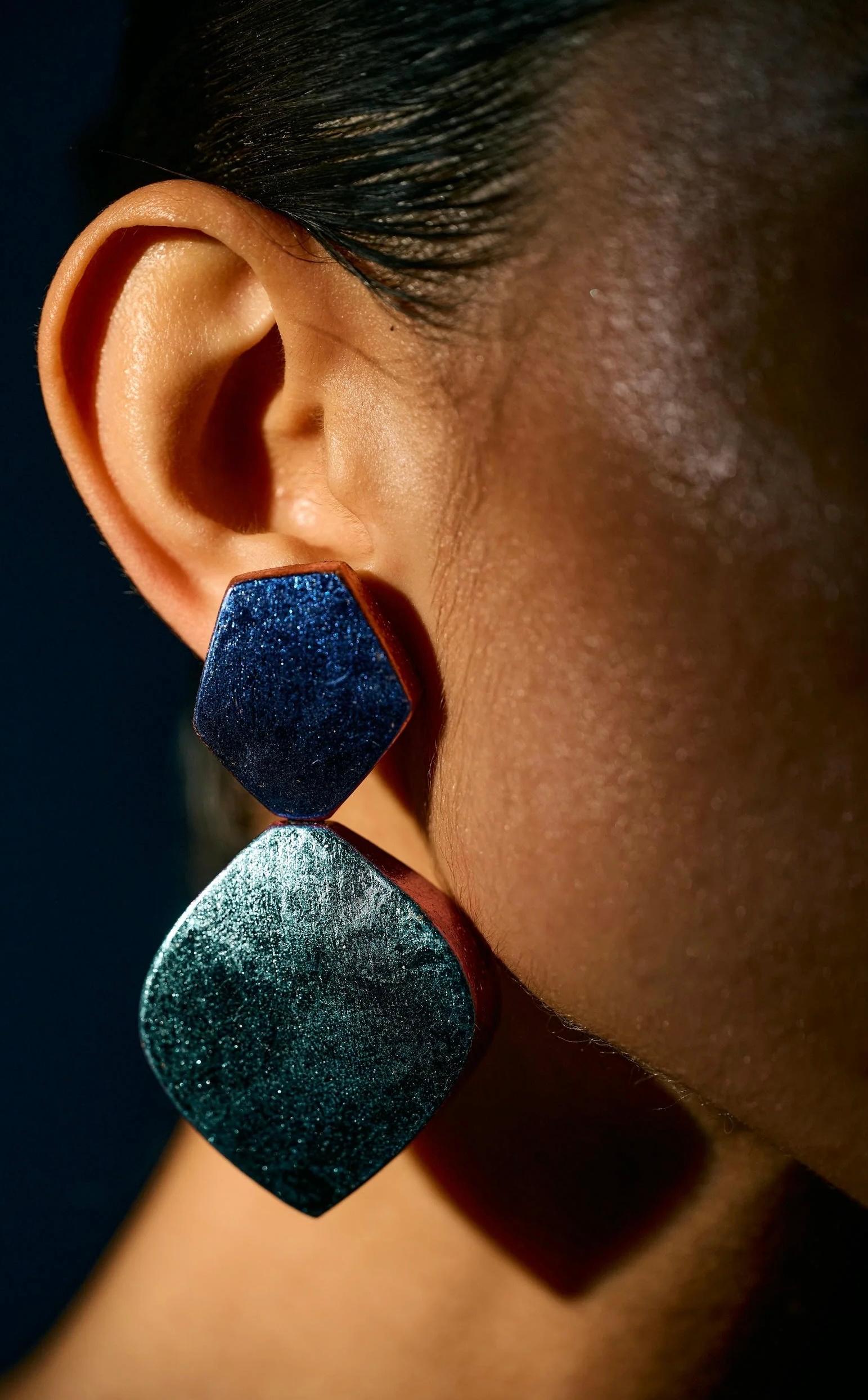 Founded in Denmark in 1973, Monies has built a five decade-long legacy by integrating raw, unmanipulated materials into designs that blur the line between jewellery and art. Monies is bold and extravagant, pushing the boundaries of conventional