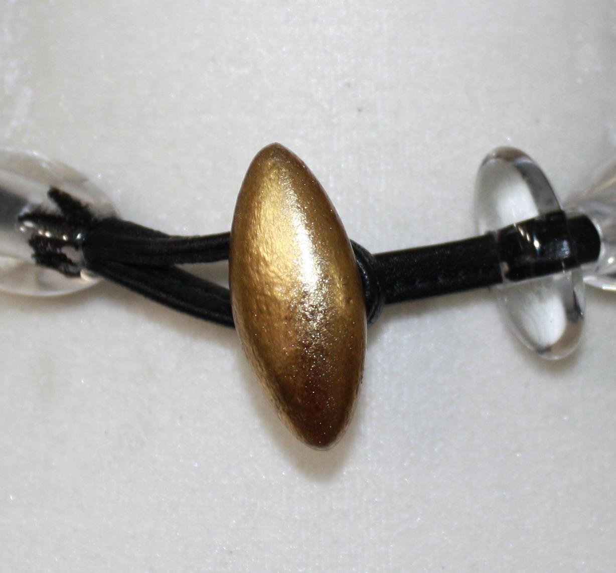 Femenino o masculino Collar Monies de acrílico y lámina dorada en venta