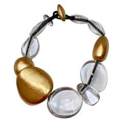 Collar Monies de acrílico y lámina dorada