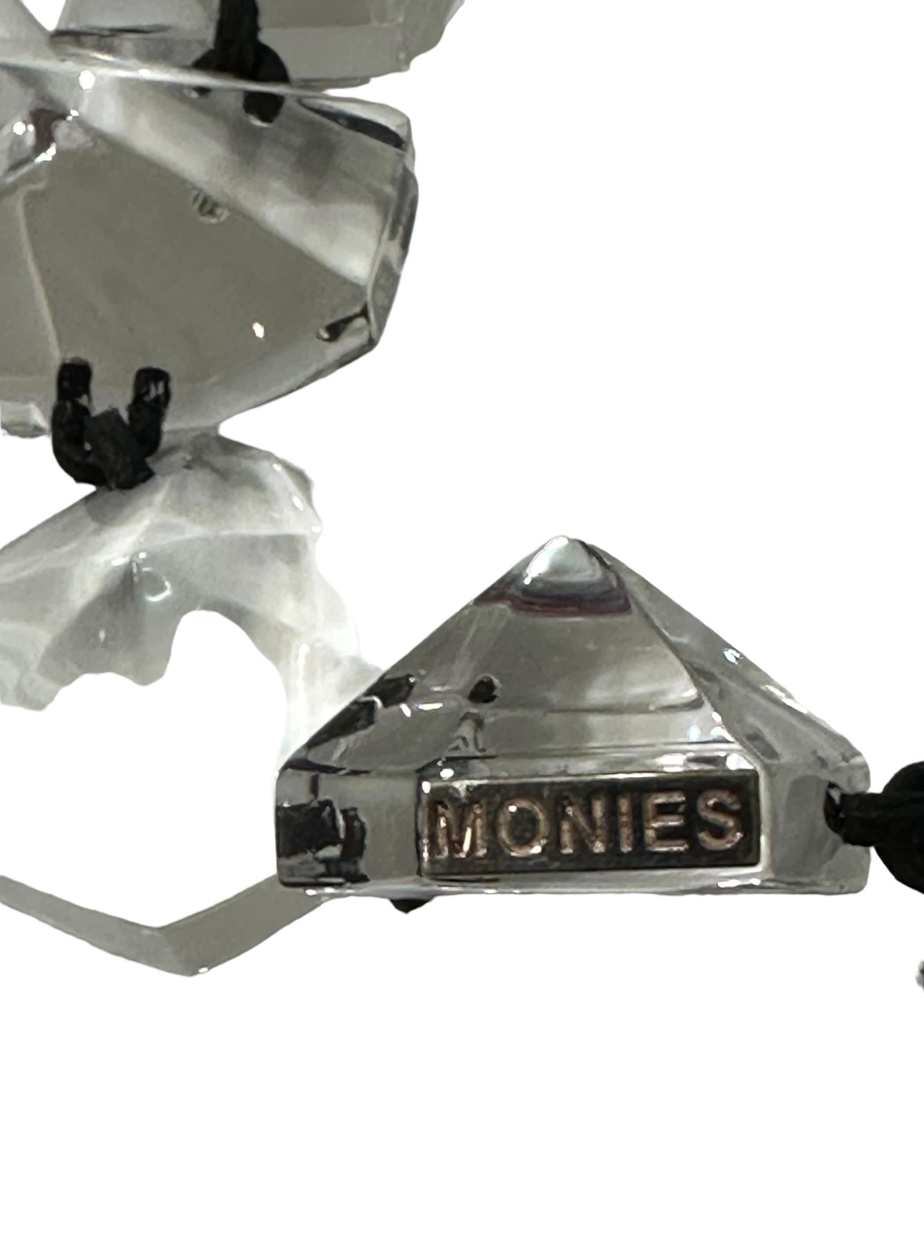 MONIES IS A DANISH JEWELRY  COMPANY FOUNDED IN 1973 BY GERDA AND NIKOLAI MONIES. ALTHOUGH BOTH ARE CLASSICALLY TRAINED GOLDSMITHS, IT WAS THEIR INTEREST AND LOVE FOR UNCONVENTIONAL NATURAL MATERIALS AND OVERSIZED AVANTGARDE JEWELLERY THAT MADE THEM