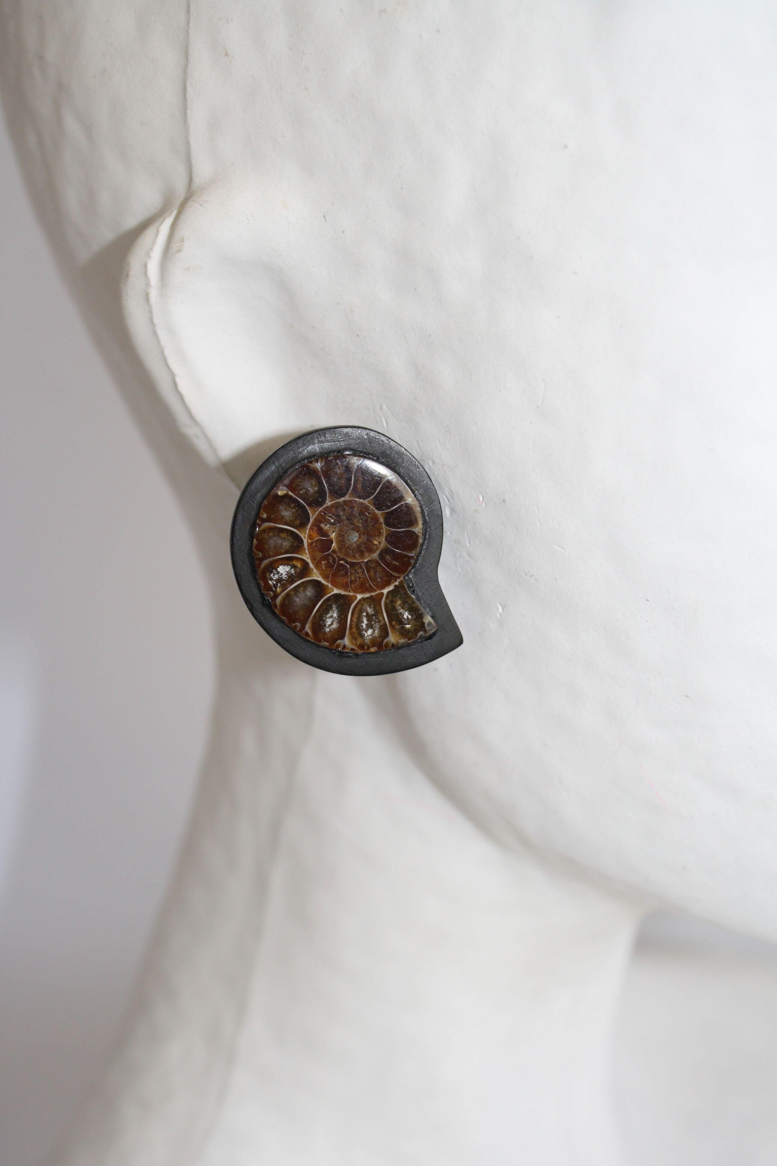 One of a kind ammonite and ebony clip earrings from Monies. 