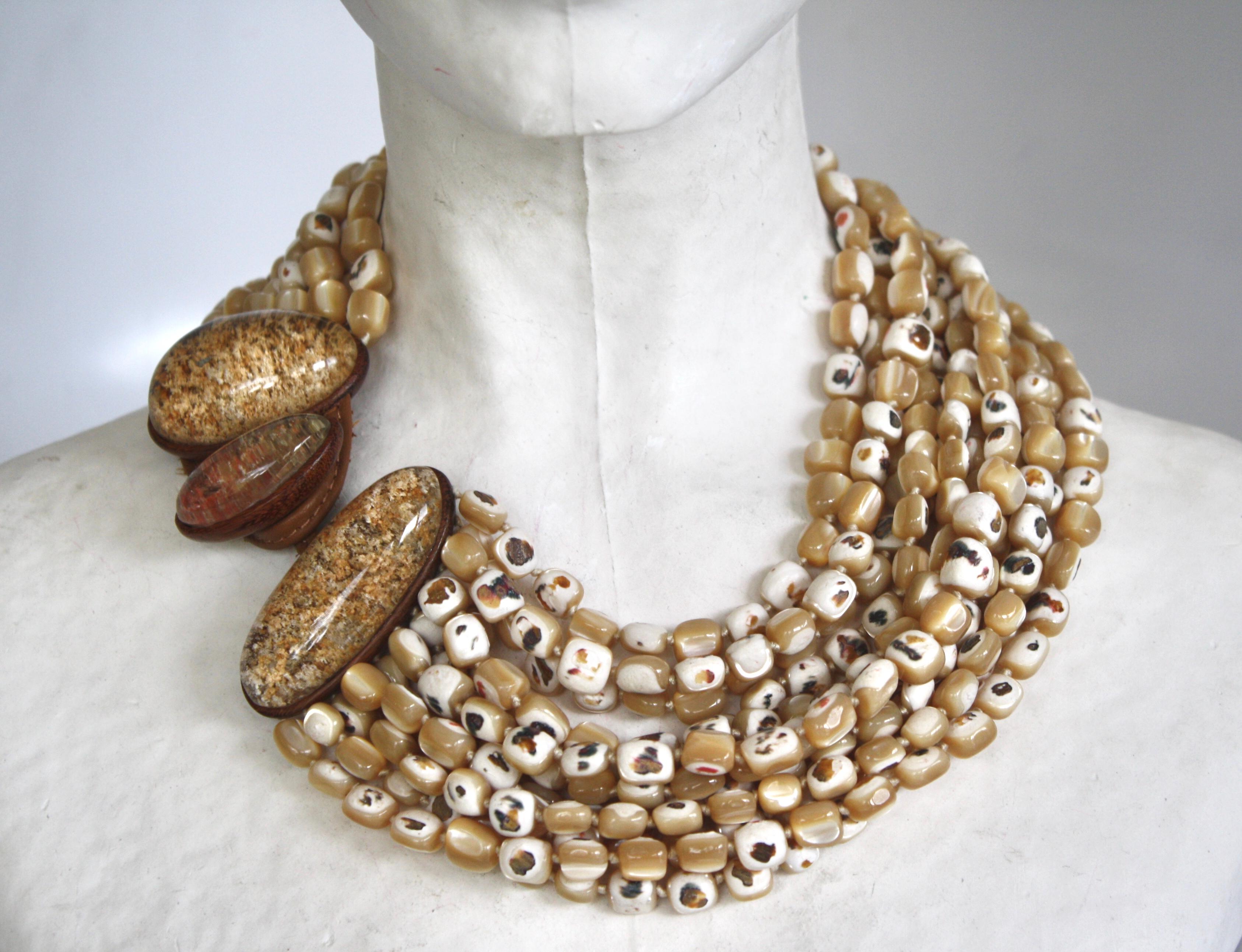 Mother of Pearl, mountain crystal, and azobe 12 strand statement necklace from Monies Denmark. 