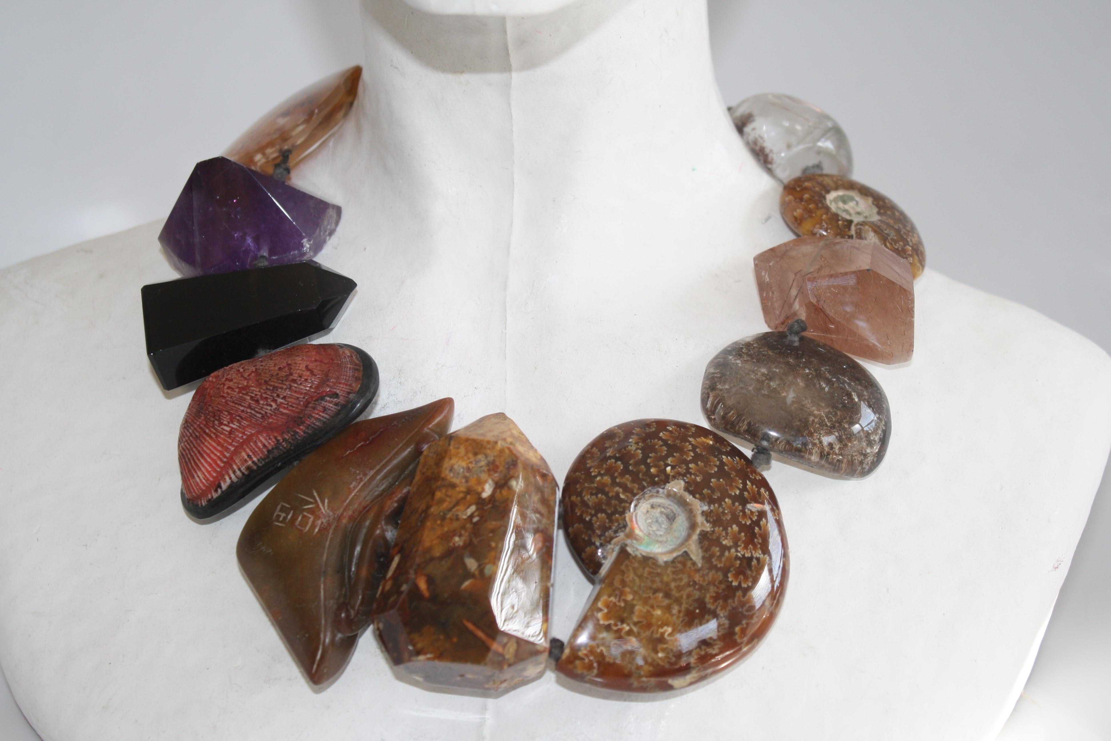 One of a kind 20” long mountain crystal, ammonite, amethyst, jade, agate and ebony necklace from Monies.  