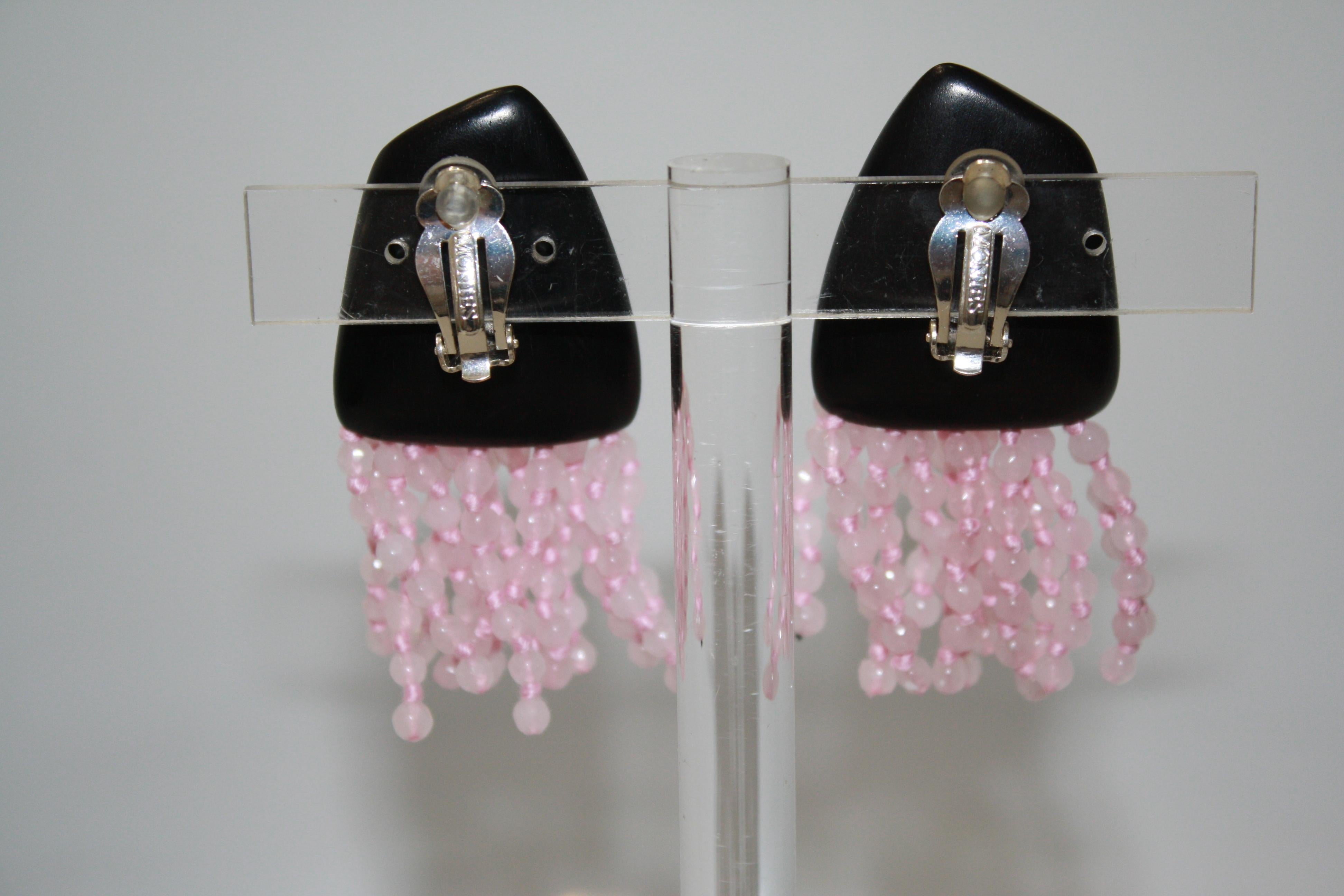 Clip earrings in ebony with multi strands of pink quartz beads.