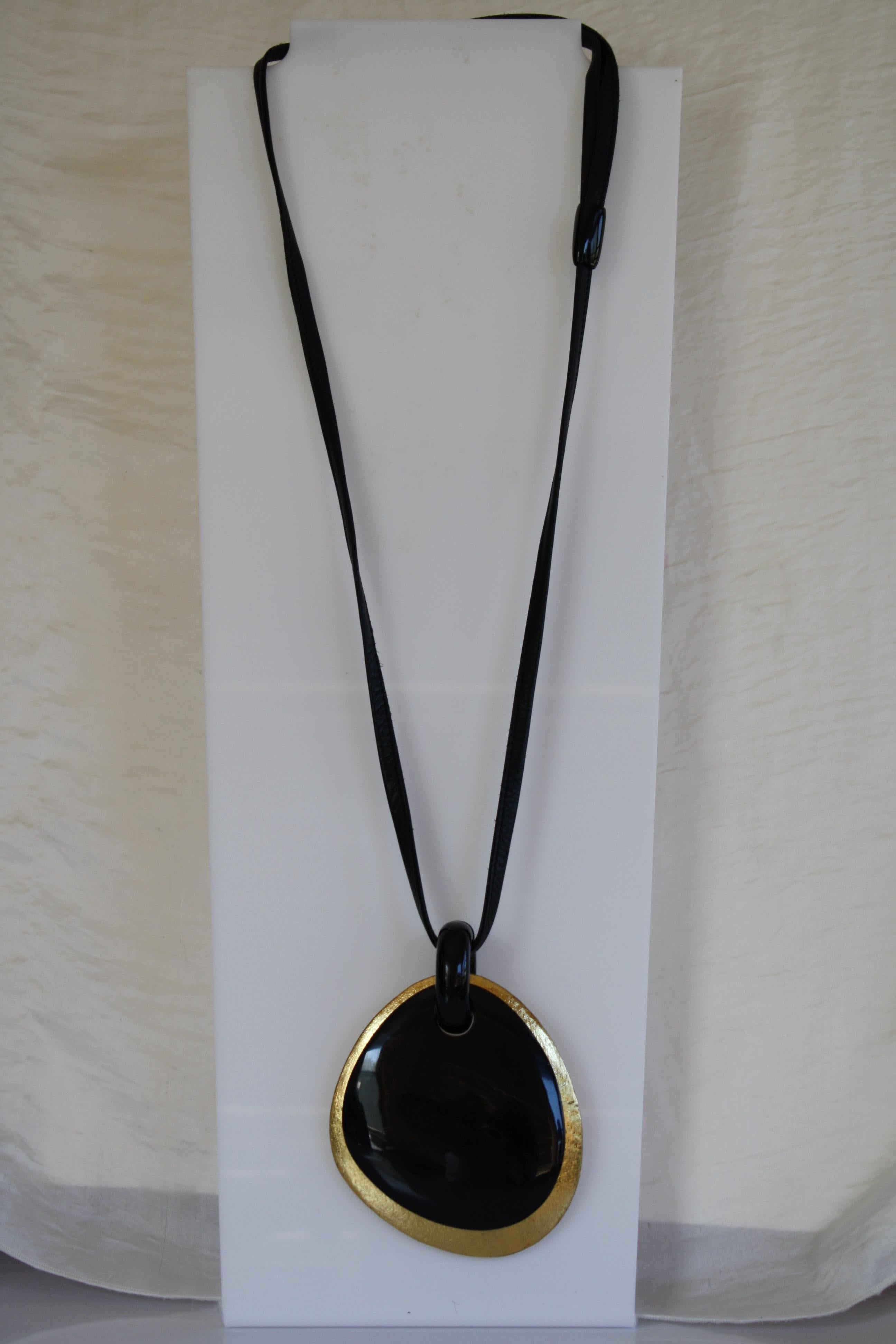 Wood, leather, and horn pendant necklace from Monies Denmark. 