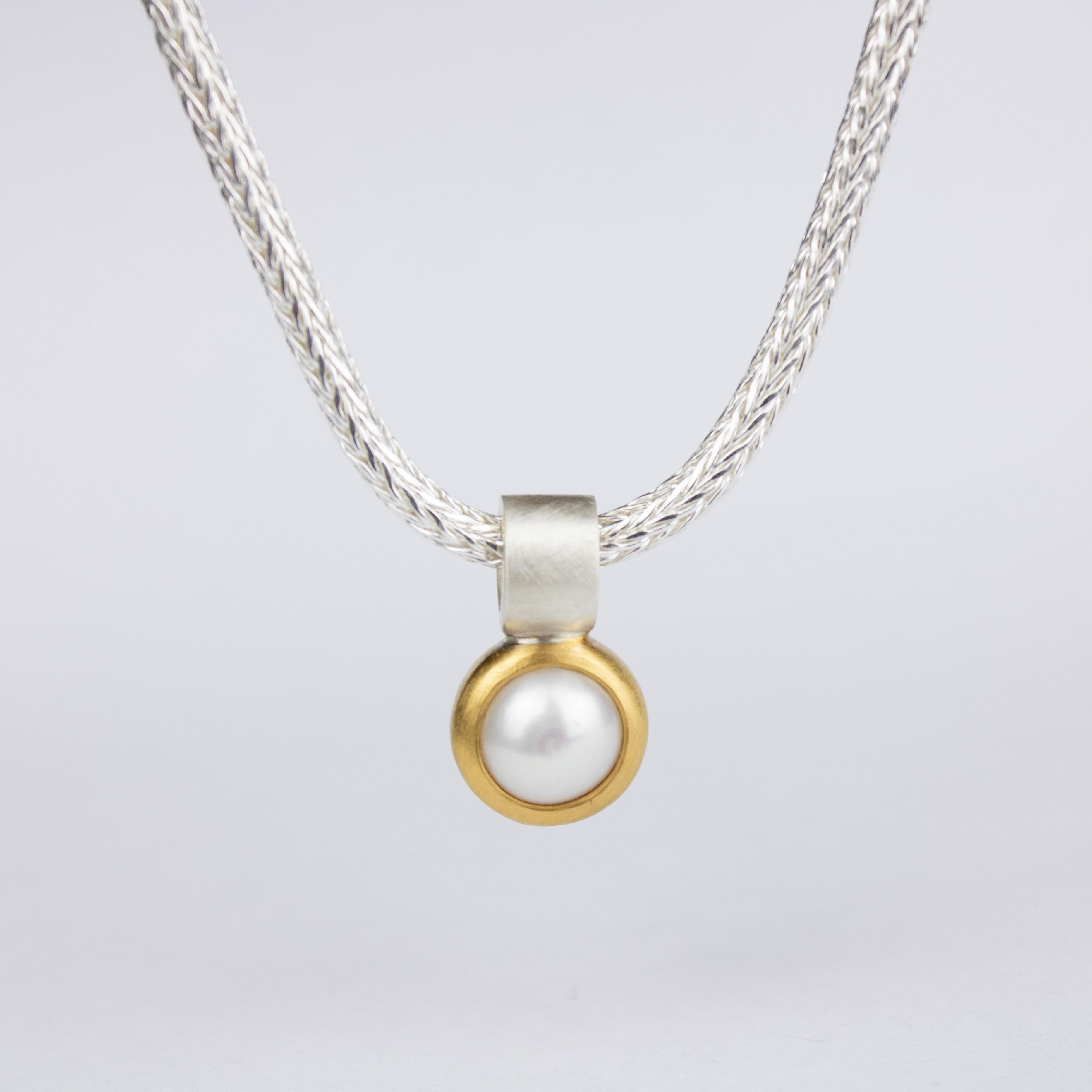 The gold plated Pearl Pendant made from Sterling Silver is part of the Pearl Collections and symbolizes the natural beauty and high quality designs of Monika Herré.

 

The wide rail gives the pendant the necessary stability to smoothly swing on a