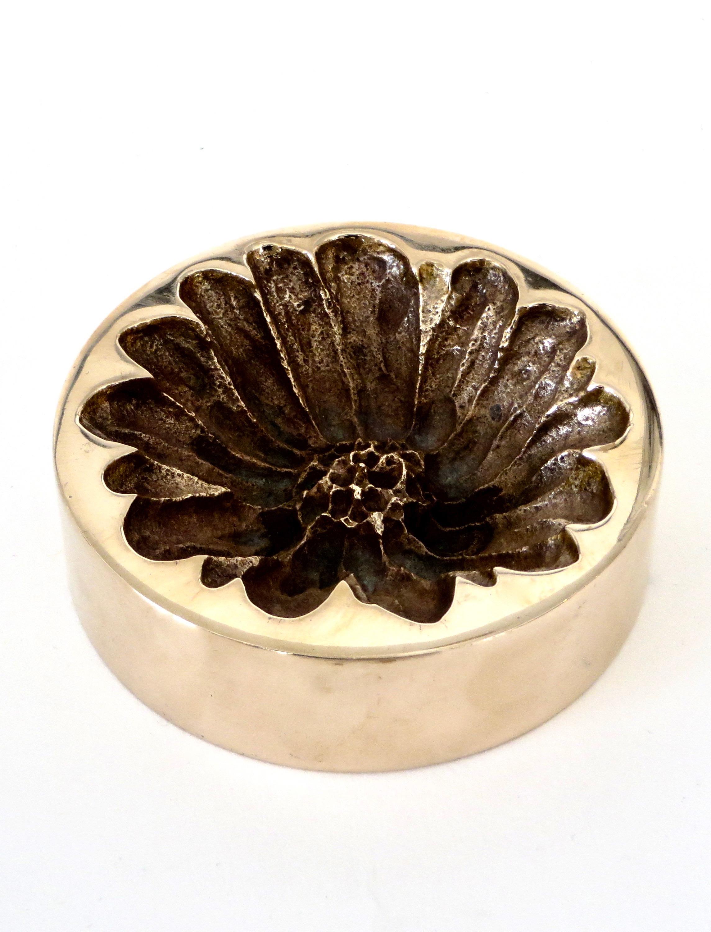 A bronze vide poche or decorative dish by French artist Monique Gerber in the motif of a daisy or marguerite.
Signed MG.
