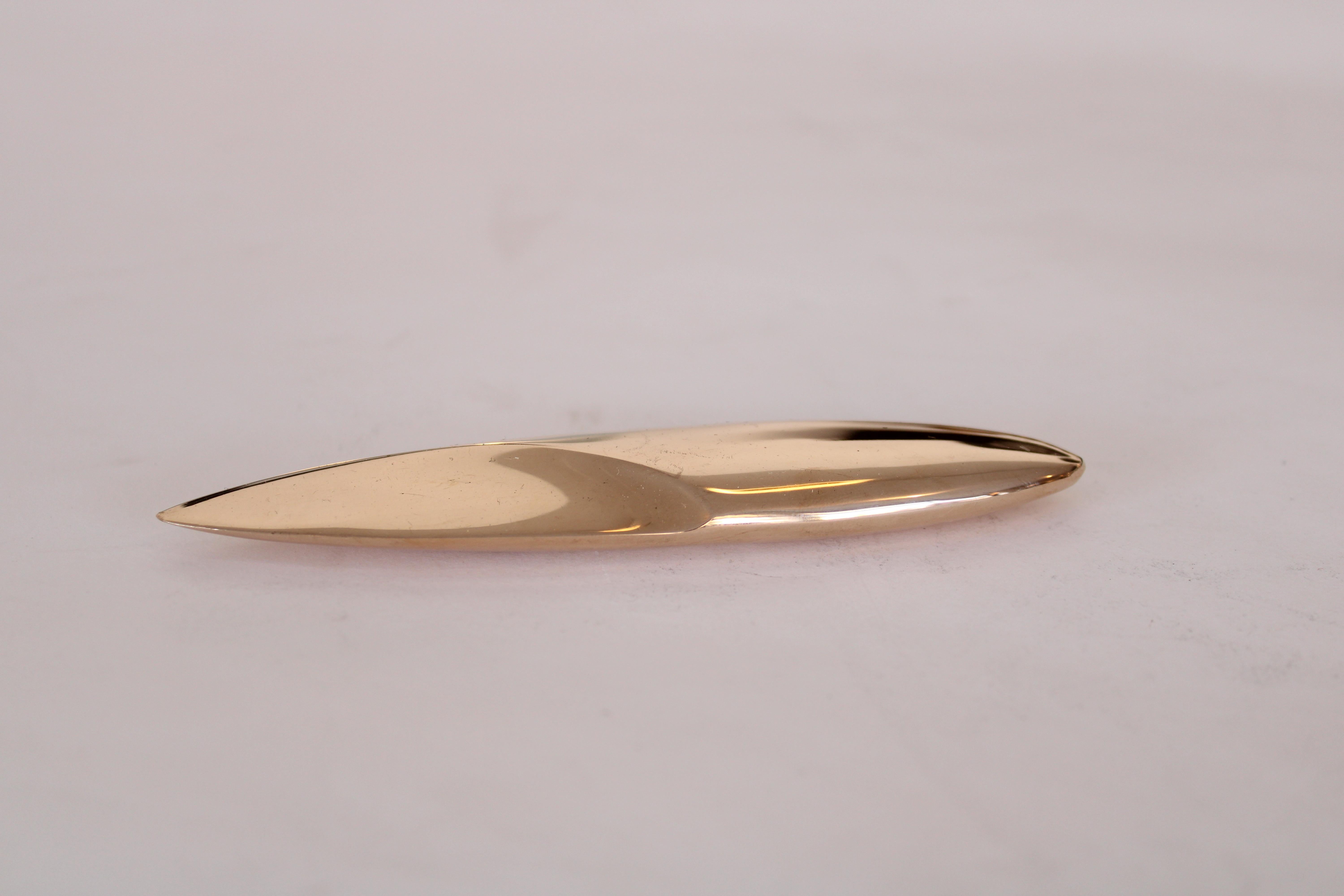 Monique Gerber French bronze cast letter opener in a very sculptural and minimalist form. Designed Monique Gerber. 
Can be used as a sculptural object or paper weight as well.
Reminiscent of a Brancusi form. 
Signed MG France.
It is rare to have the