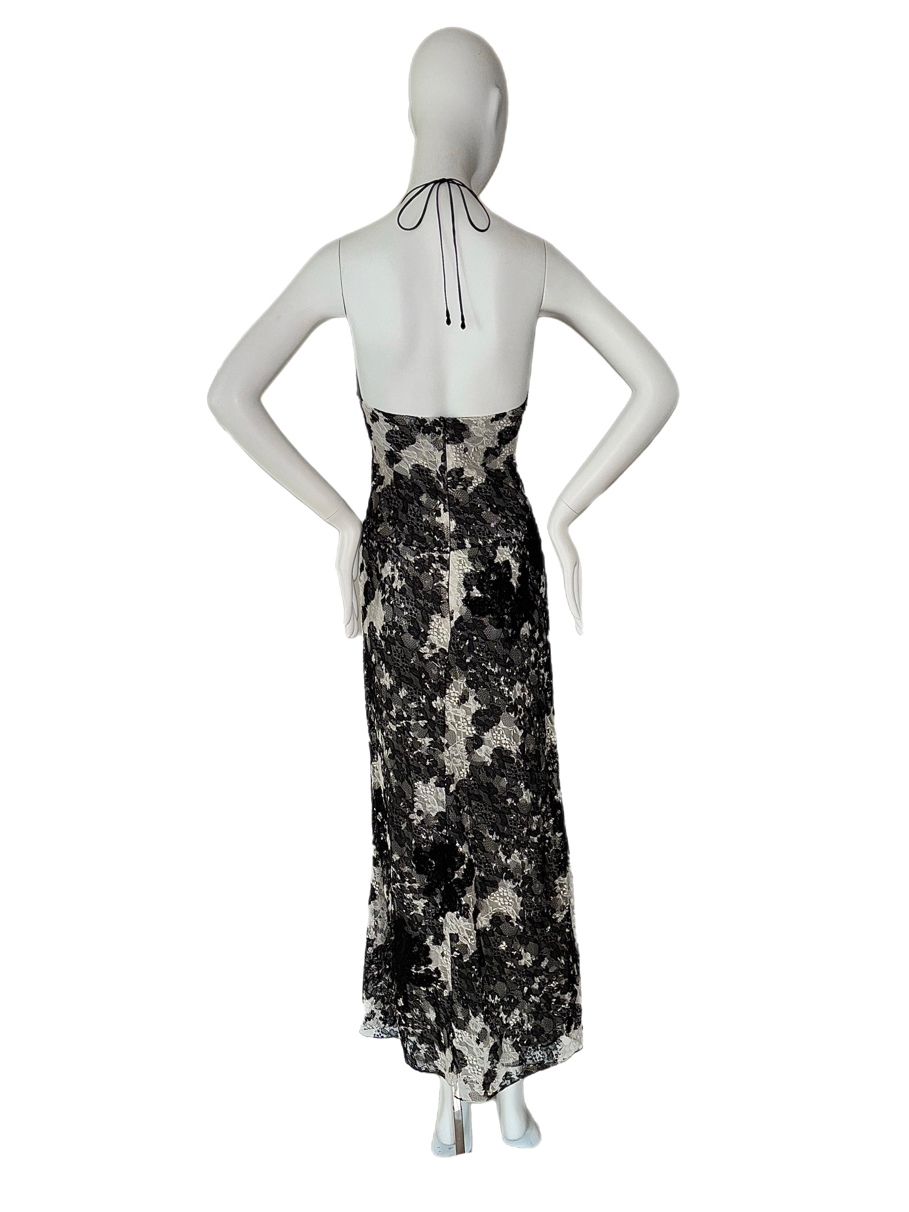 Monique Lhuillier
FW03
Vintage
Runway
Lace camo effect
Black and White lace with cowl neck (adjustable neck tie) and skin showing side slit
Size USA 2 fits very TTS aka XS
Excellent vintage condition, minor feeling of wear, on the inside bra side