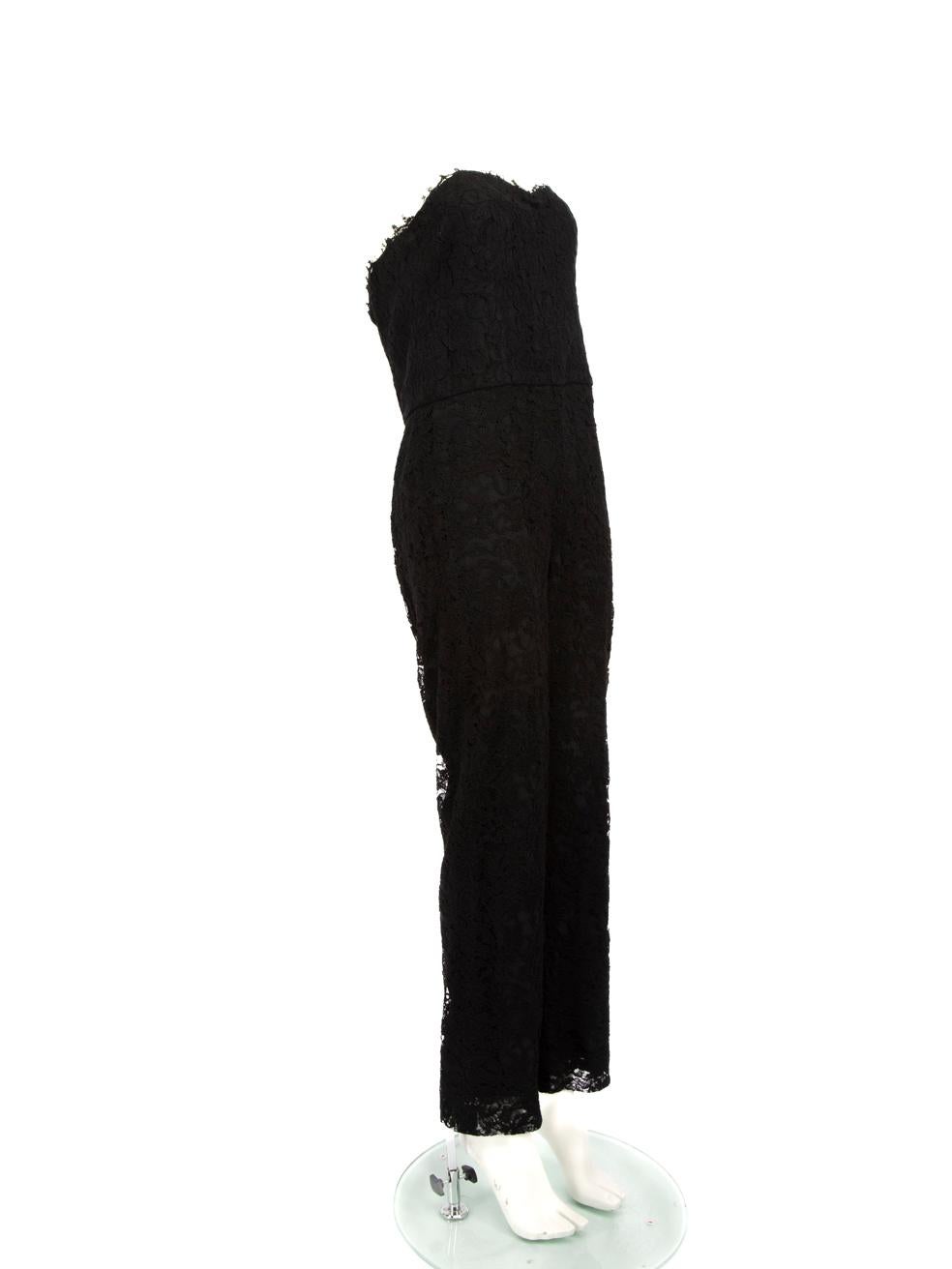 CONDITION is Very good. Minimal wear to the jumpsuit is evident. There is a hole to the front of the lace layer. Loose threads to the top front right and front left. The brand label is partly loose on this used Monique Lhuillier designer resale